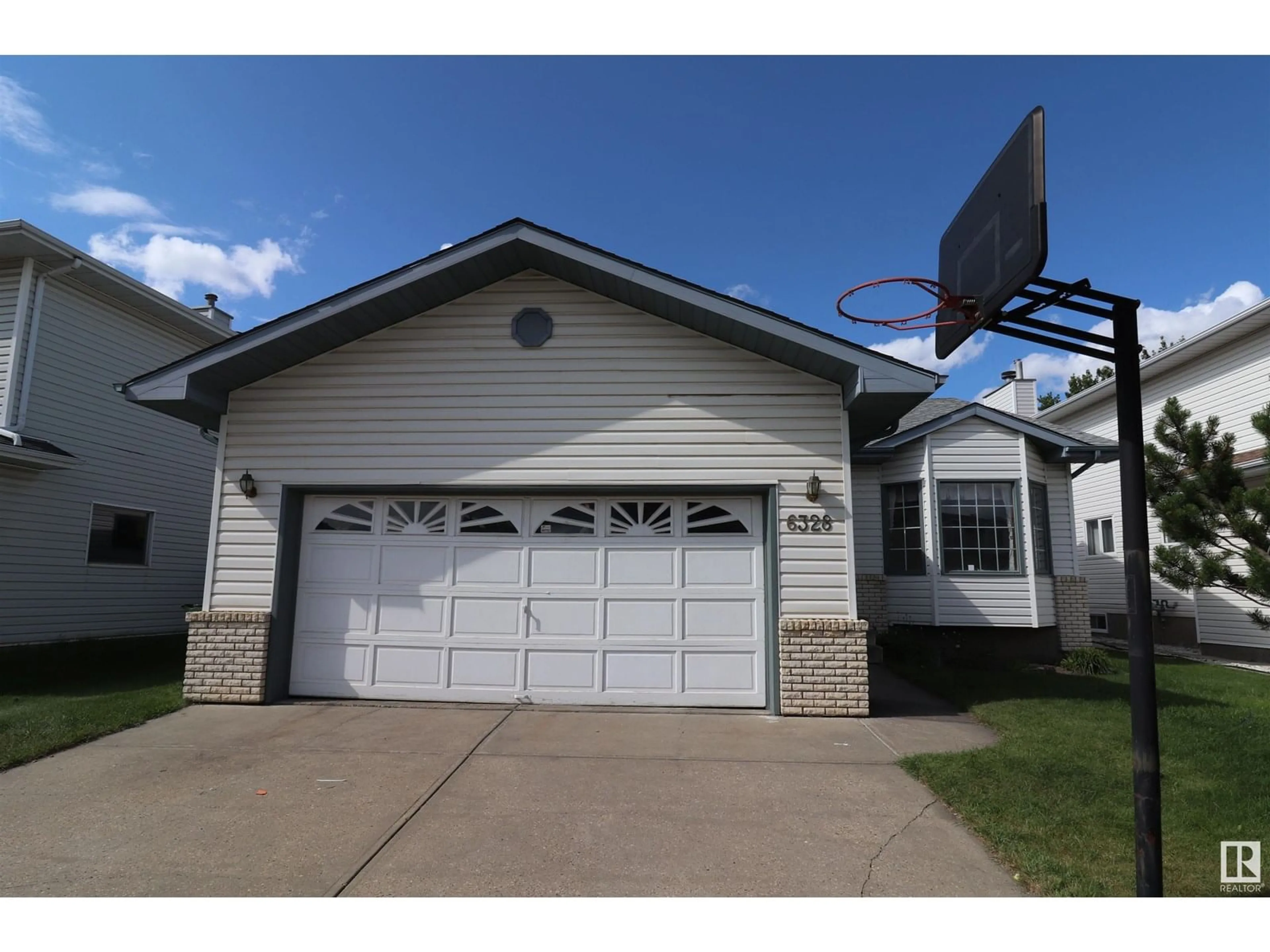 Home with vinyl exterior material, street for 6328 160 AV, Edmonton Alberta T5Y2P9