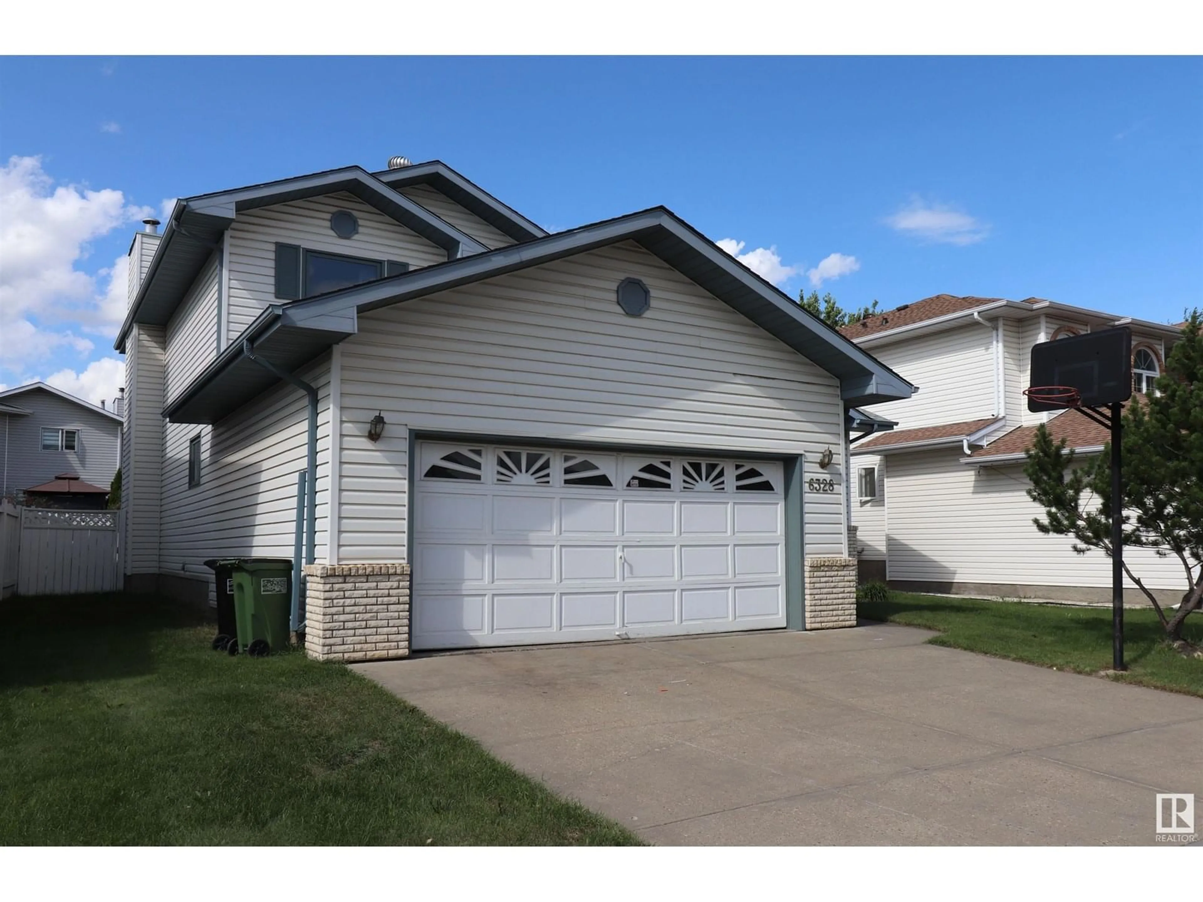 Home with vinyl exterior material, street for 6328 160 AV, Edmonton Alberta T5Y2P9