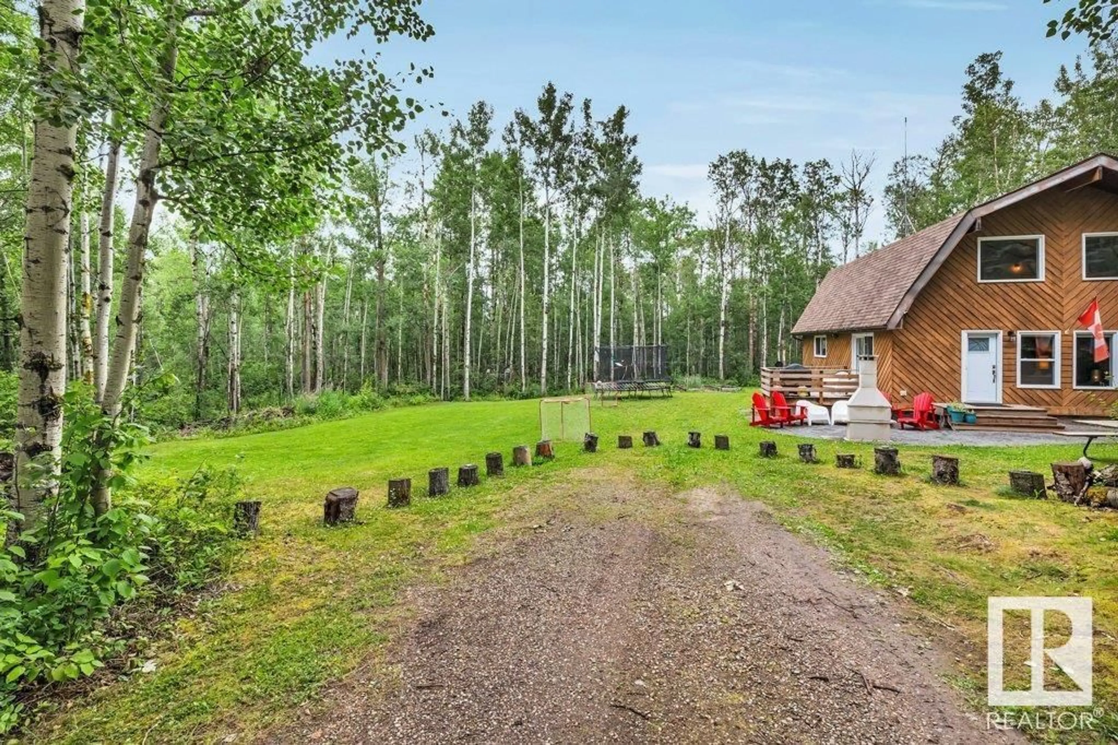 A pic from outside/outdoor area/front of a property/back of a property/a pic from drone, forest/trees view for 463017 - 18 RGE RD 12, Rural Wetaskiwin County Alberta T0C2V0