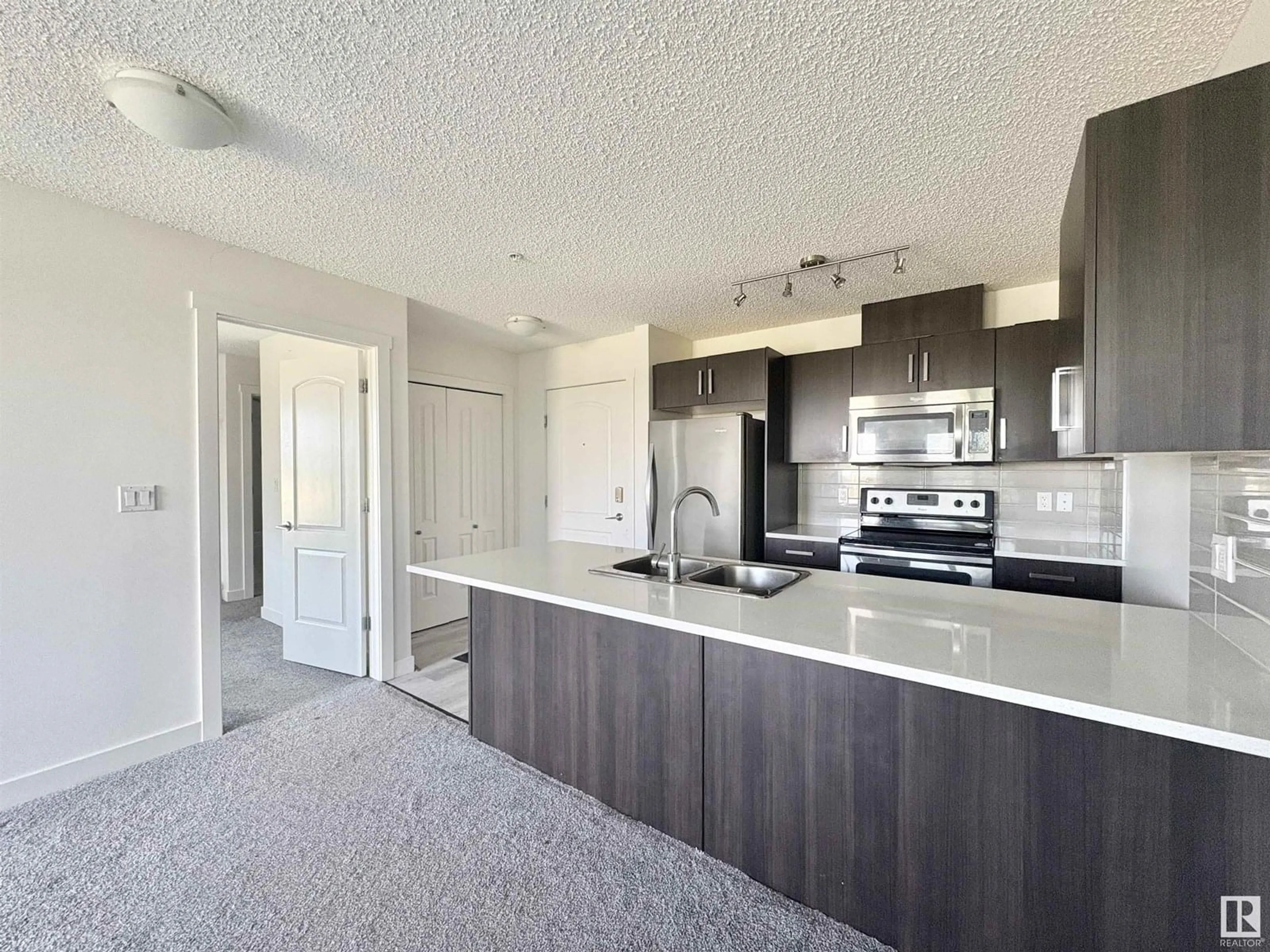 Open concept kitchen, unknown for 312 - 667 WATT BV, Edmonton Alberta T6X0Y2