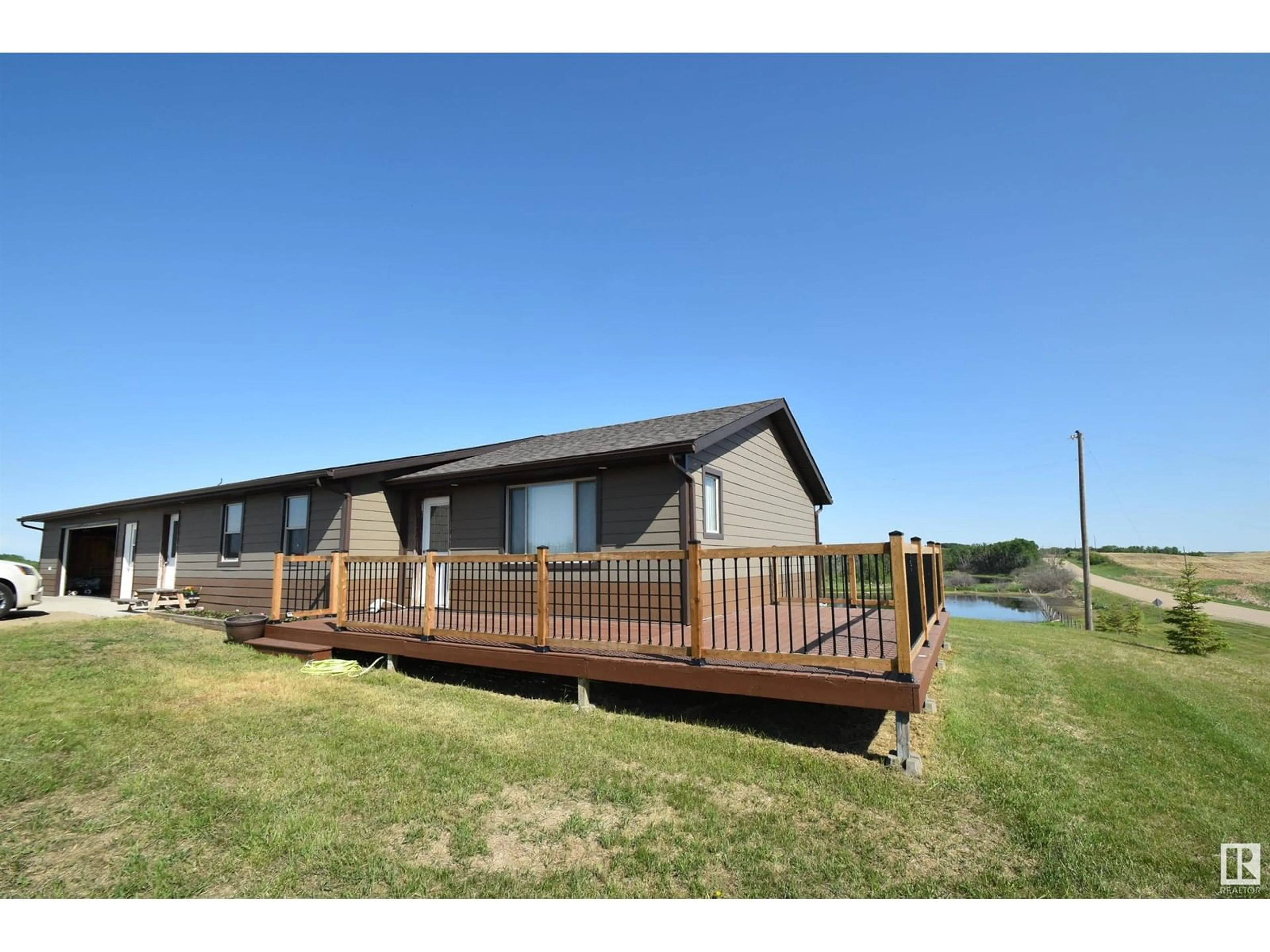 A pic from outside/outdoor area/front of a property/back of a property/a pic from drone, water/lake/river/ocean view for 57104 RNG RD 103, Rural St. Paul County Alberta T0A3A1