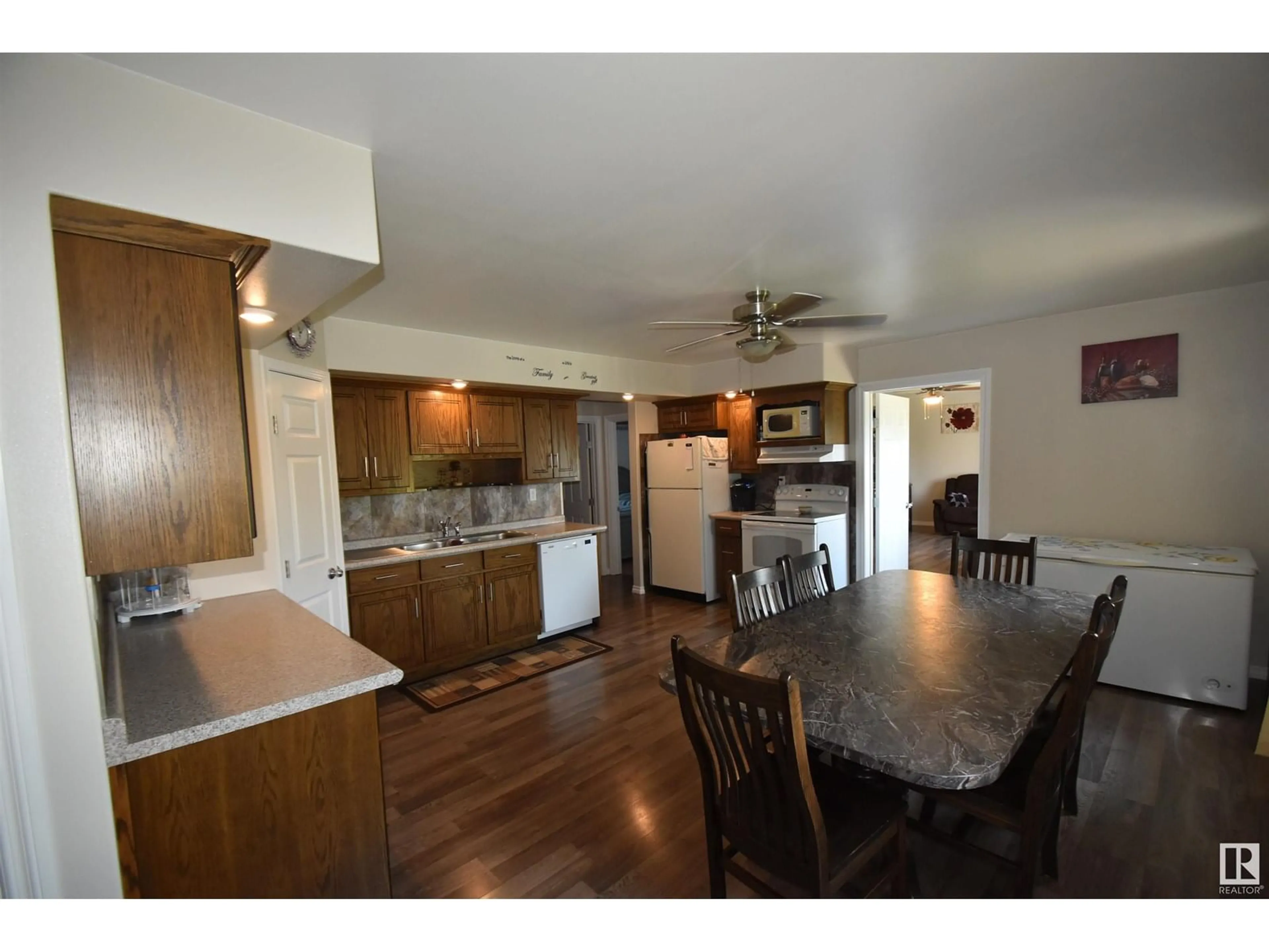 Open concept kitchen, wood/laminate floor for 57104 RNG RD 103, Rural St. Paul County Alberta T0A3A1