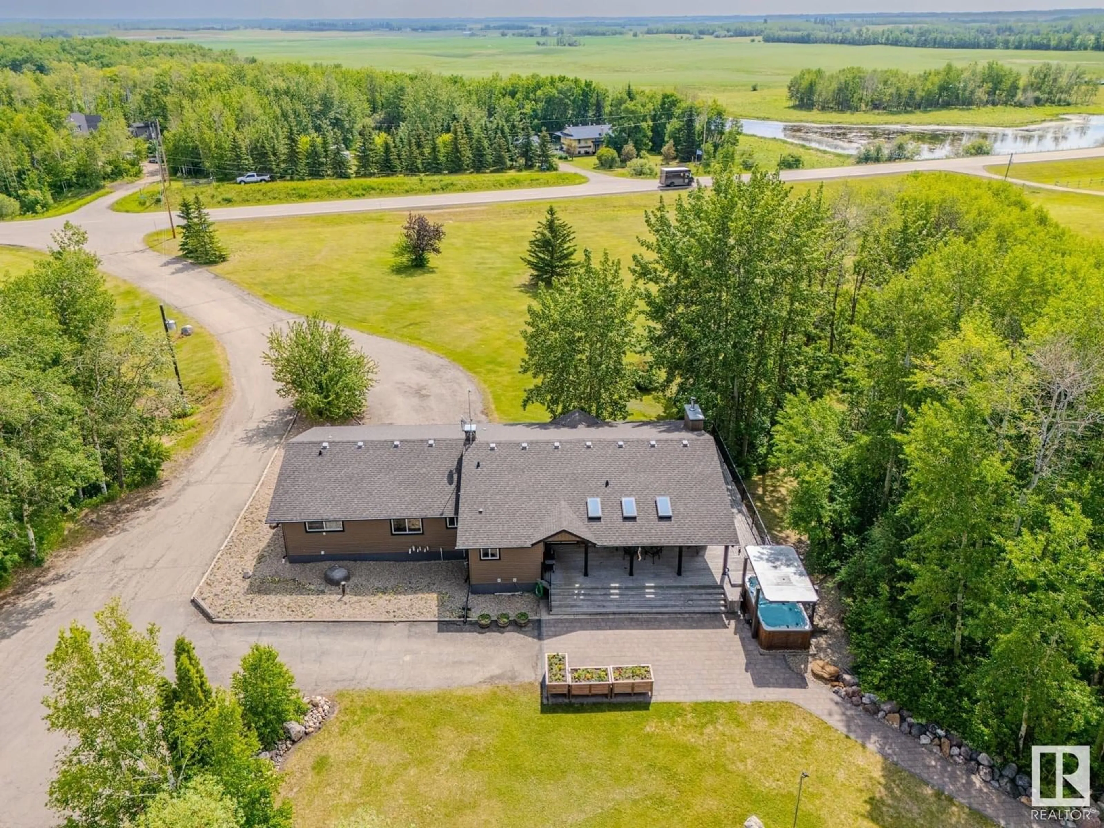 A pic from outside/outdoor area/front of a property/back of a property/a pic from drone, water/lake/river/ocean view for 49072 RGE ROAD 233, Rural Leduc County Alberta T0C1Z0