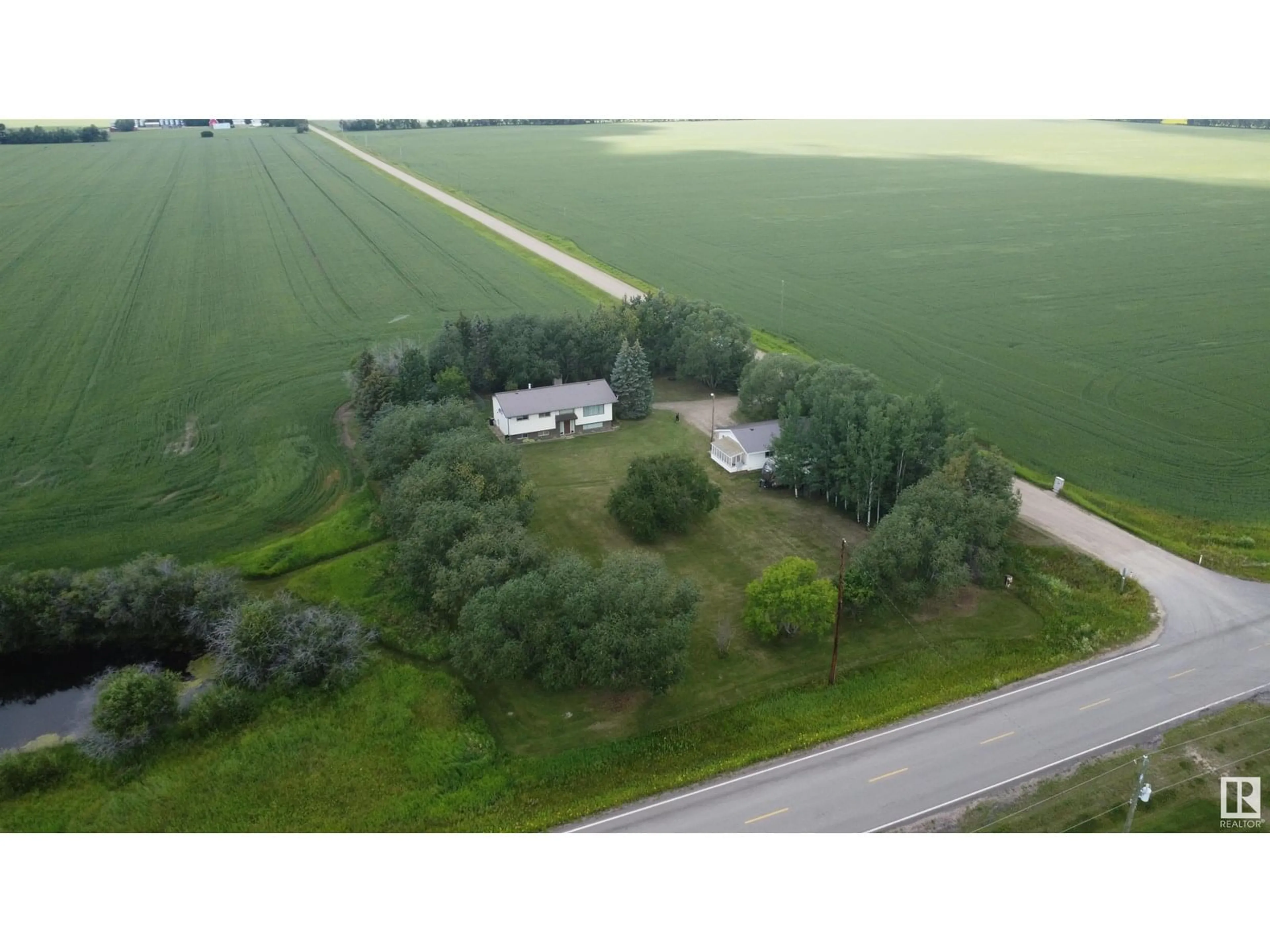 A pic from outside/outdoor area/front of a property/back of a property/a pic from drone, unknown for 2001 TWP RD 604, Rural Westlock County Alberta T7P2N9