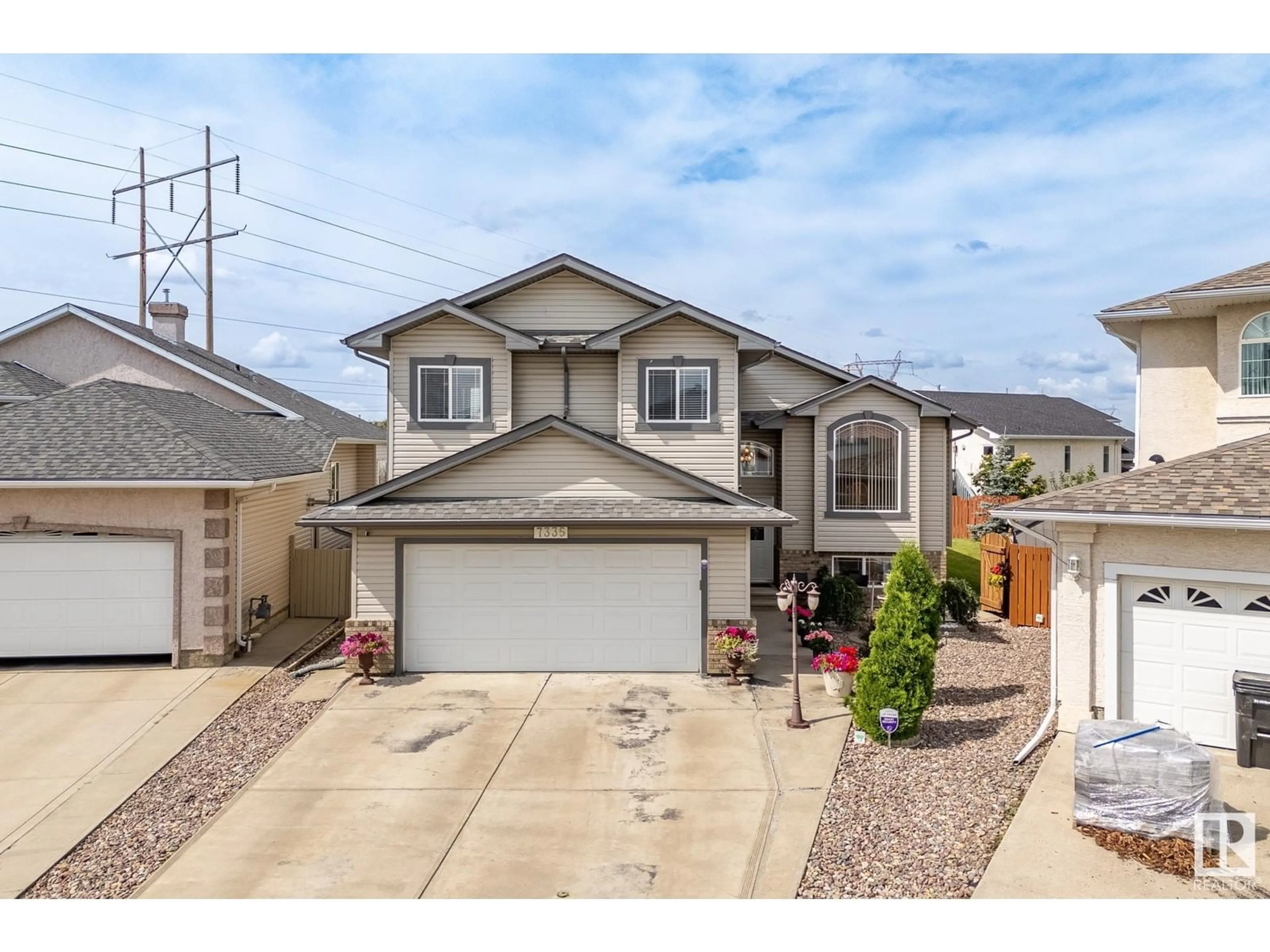 Home with vinyl exterior material, street for 7335 164 AV, Edmonton Alberta T5Z3Y3
