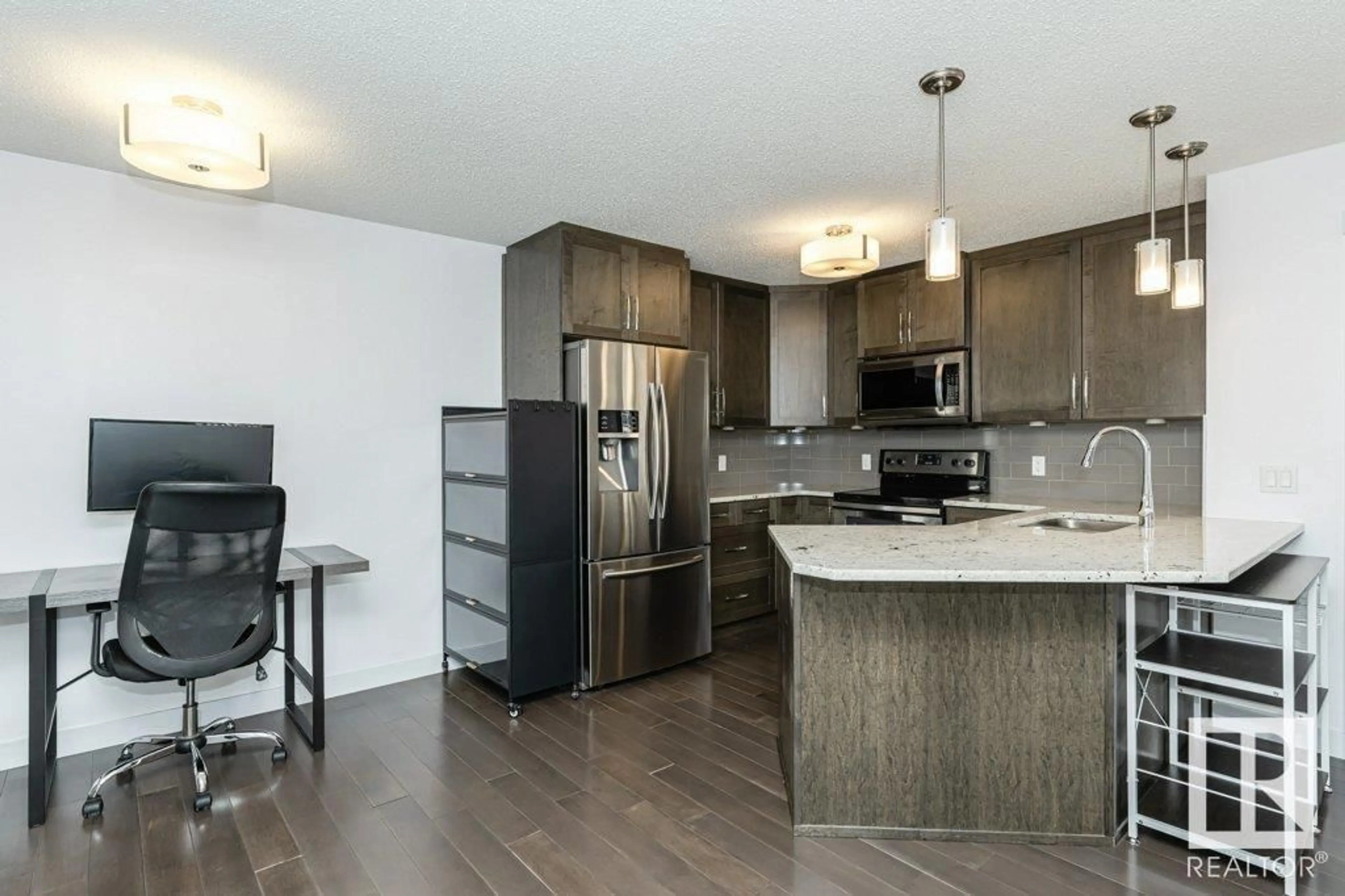 Open concept kitchen, wood/laminate floor for 304 - 2207 44 AV NW, Edmonton Alberta T6T0T2