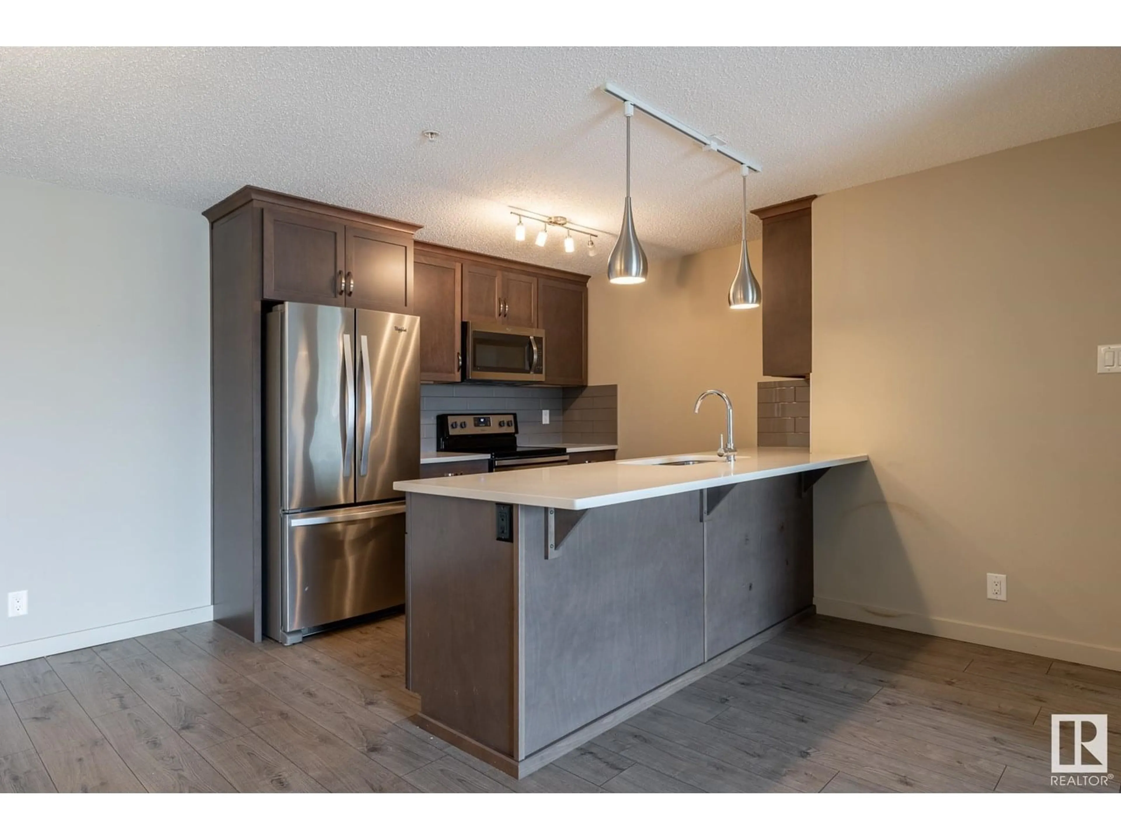 Open concept kitchen, unknown for #216 - 4008 SAVARYN DR, Edmonton Alberta T6X2E5