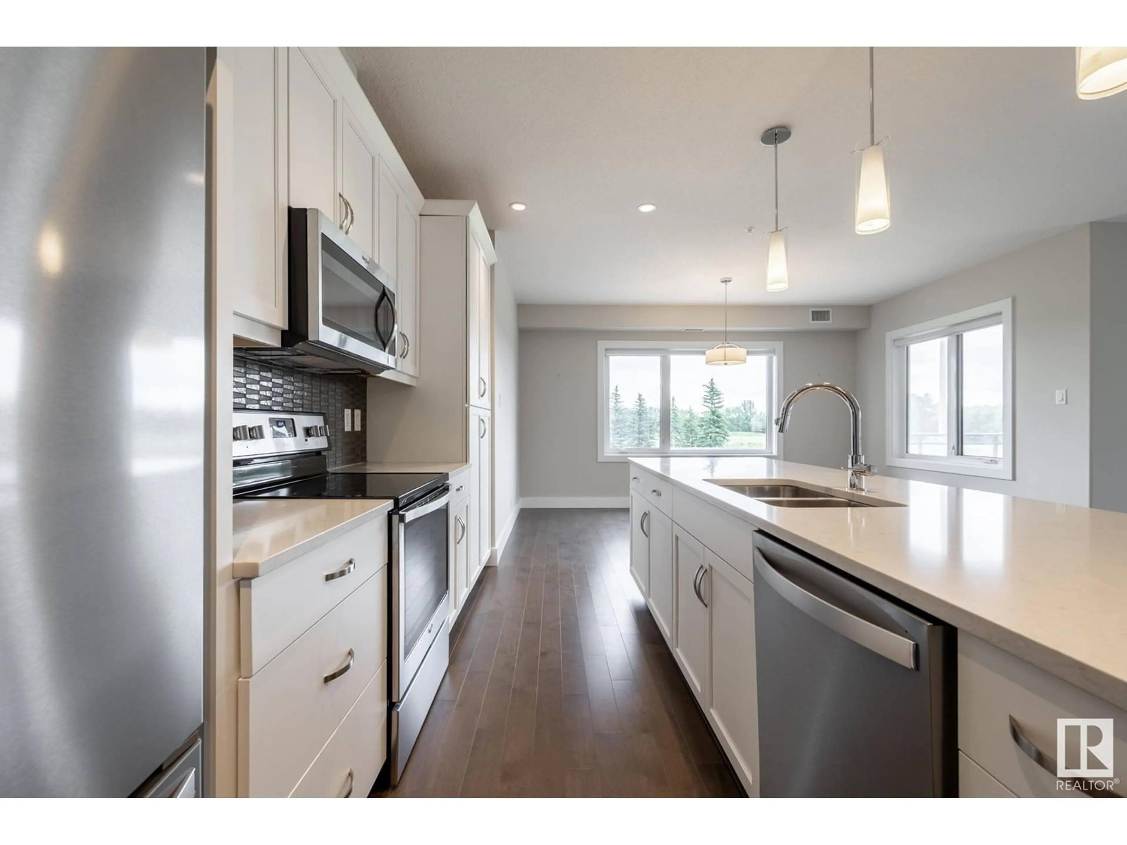Open concept kitchen, wood/laminate floor for 232 - 11074 ELLERSLIE RD, Edmonton Alberta T6W2C2