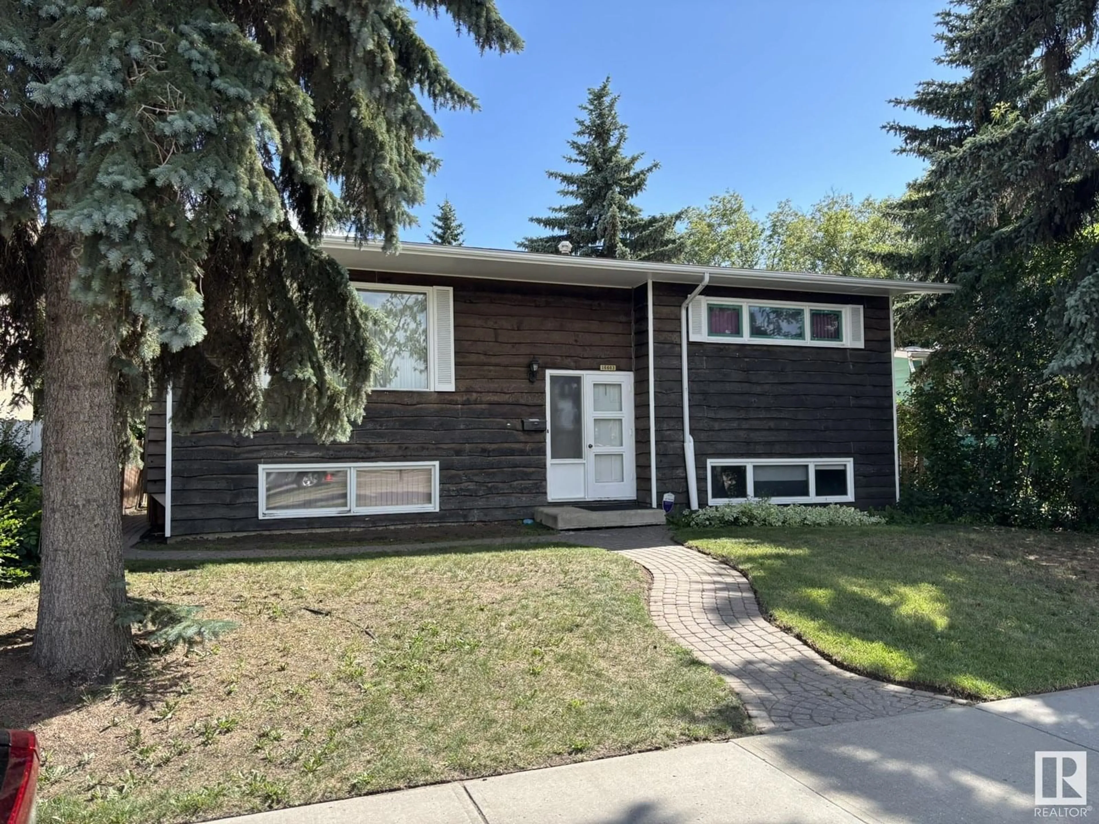 Home with vinyl exterior material, street for NW - 16603 95 AV, Edmonton Alberta T5P0B1