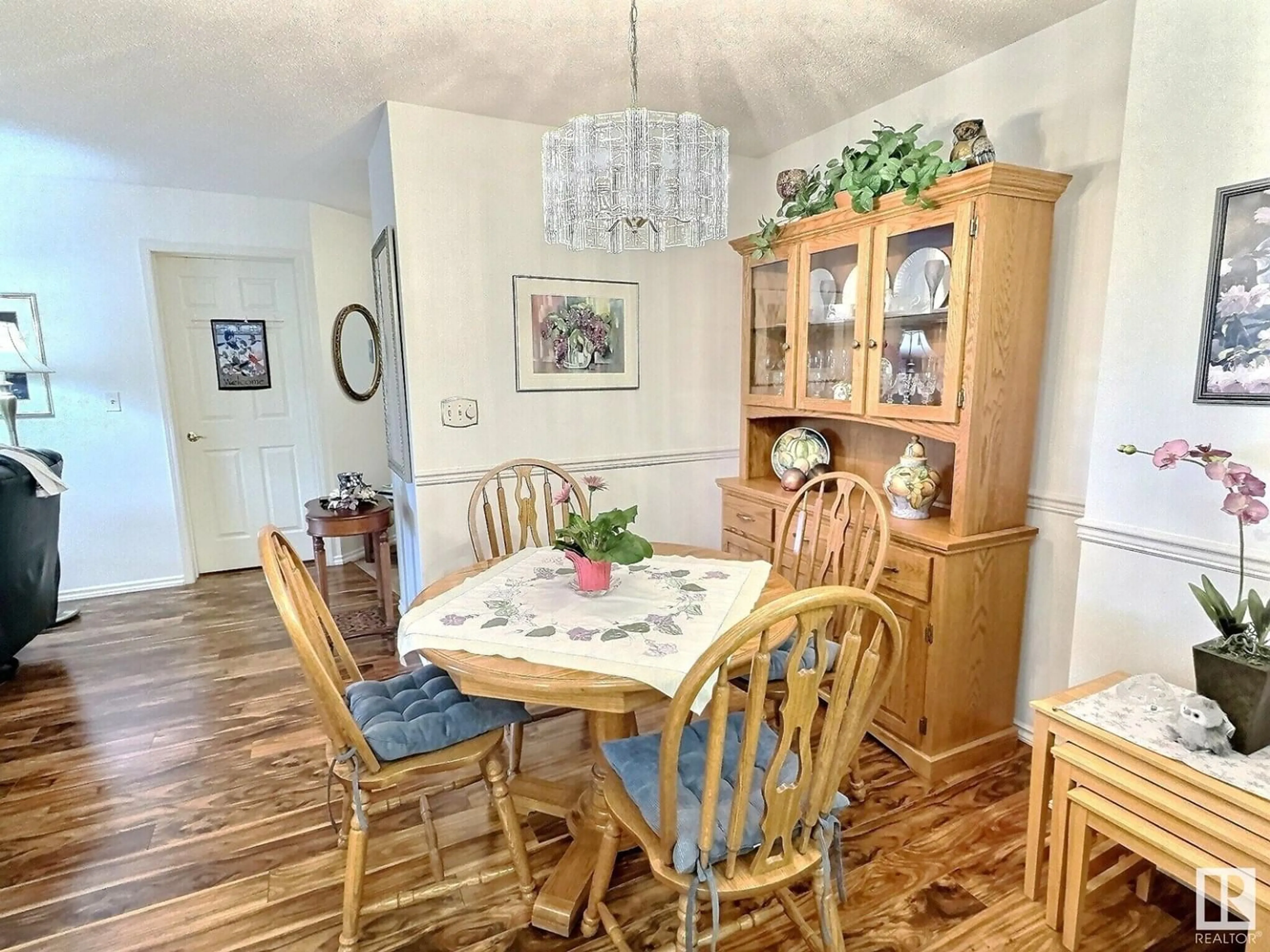Dining room, wood/laminate floor for 208 - 10945 21 AV, Edmonton Alberta T6J6R3