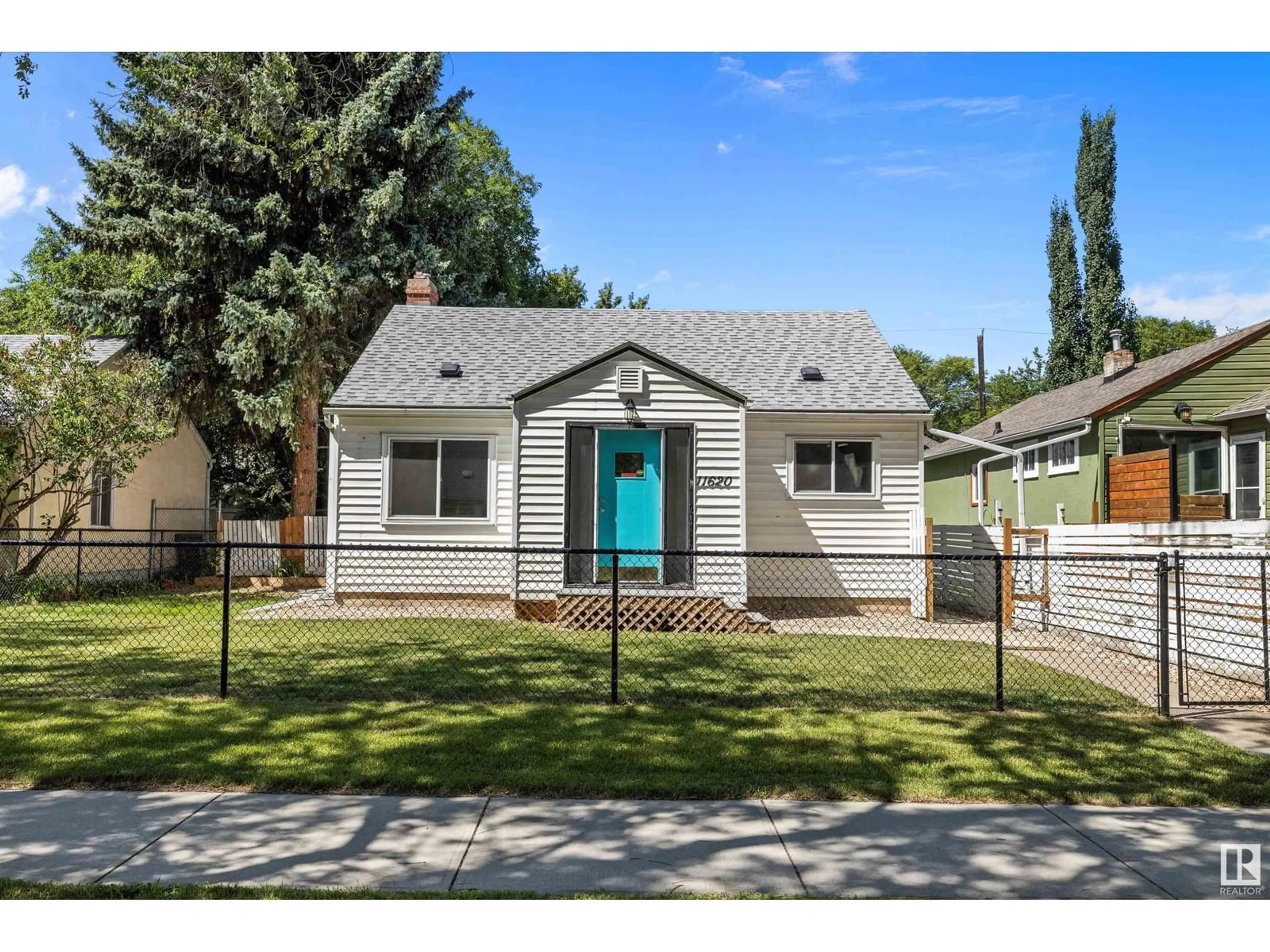 Home with vinyl exterior material, street for 11620 84 ST, Edmonton Alberta T5B3B9