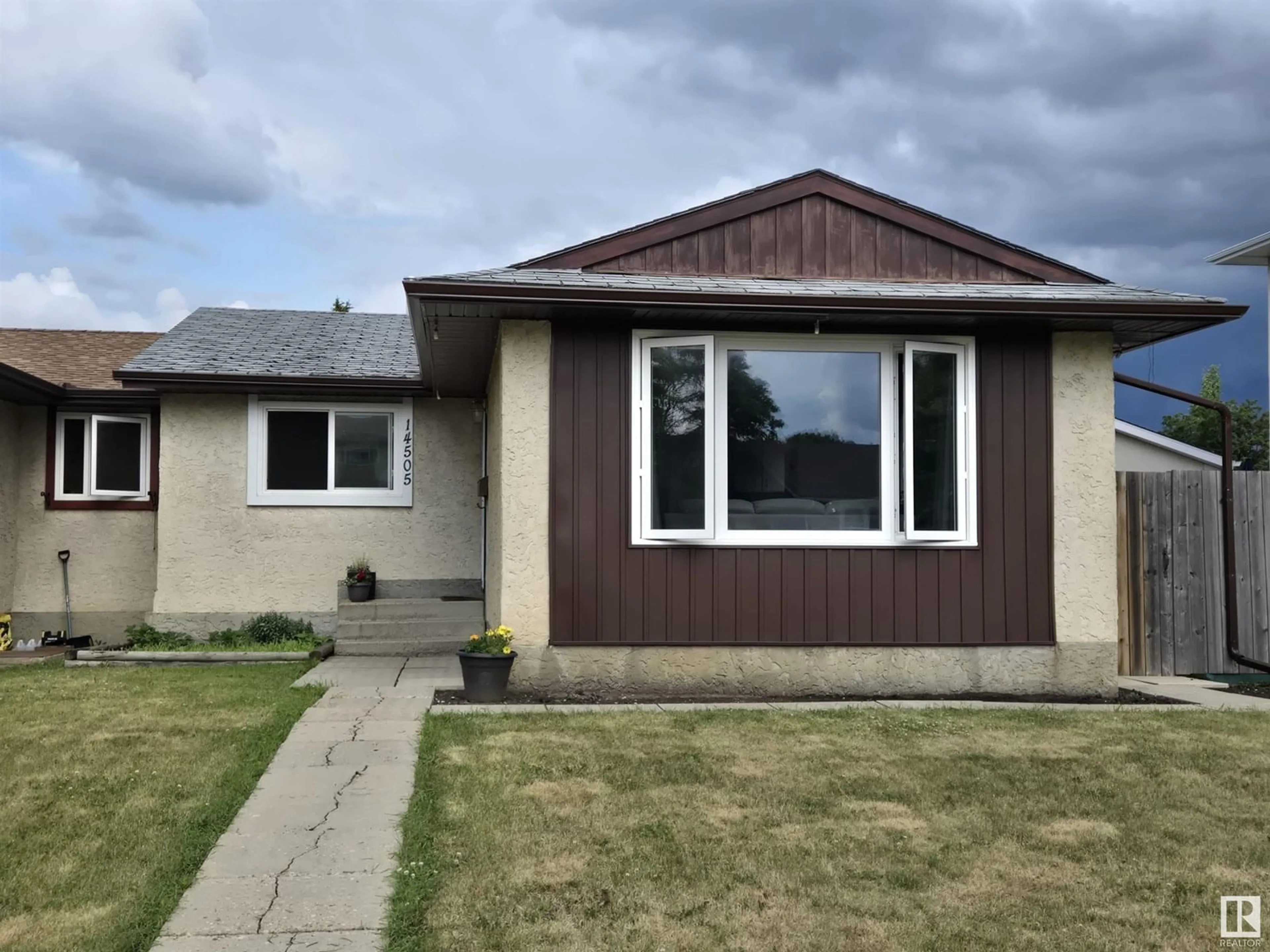 Home with vinyl exterior material, street for 14505 23 ST, Edmonton Alberta T5Y1T4