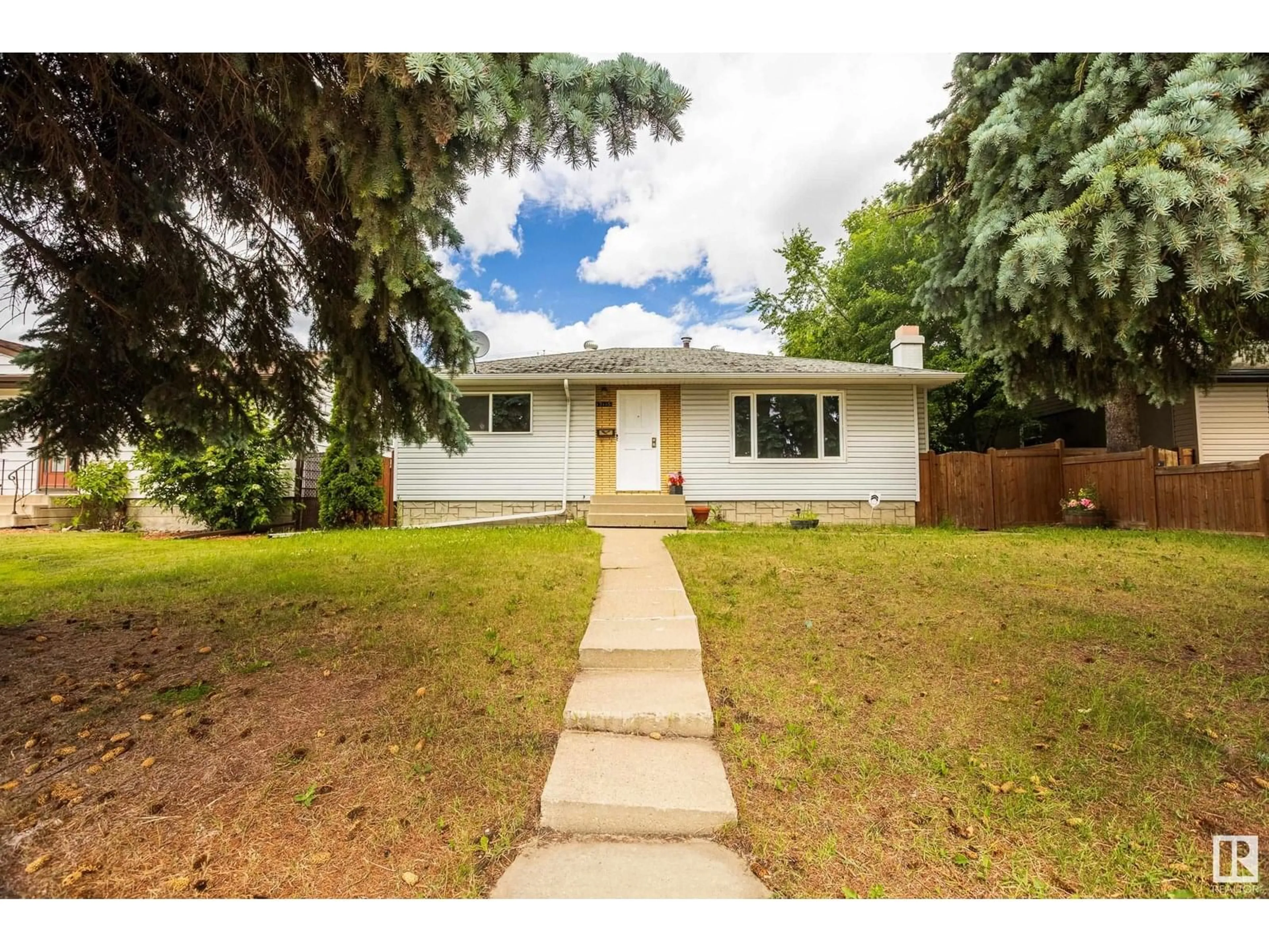 Home with vinyl exterior material, street for 13116 136 AV, Edmonton Alberta T5L4B3