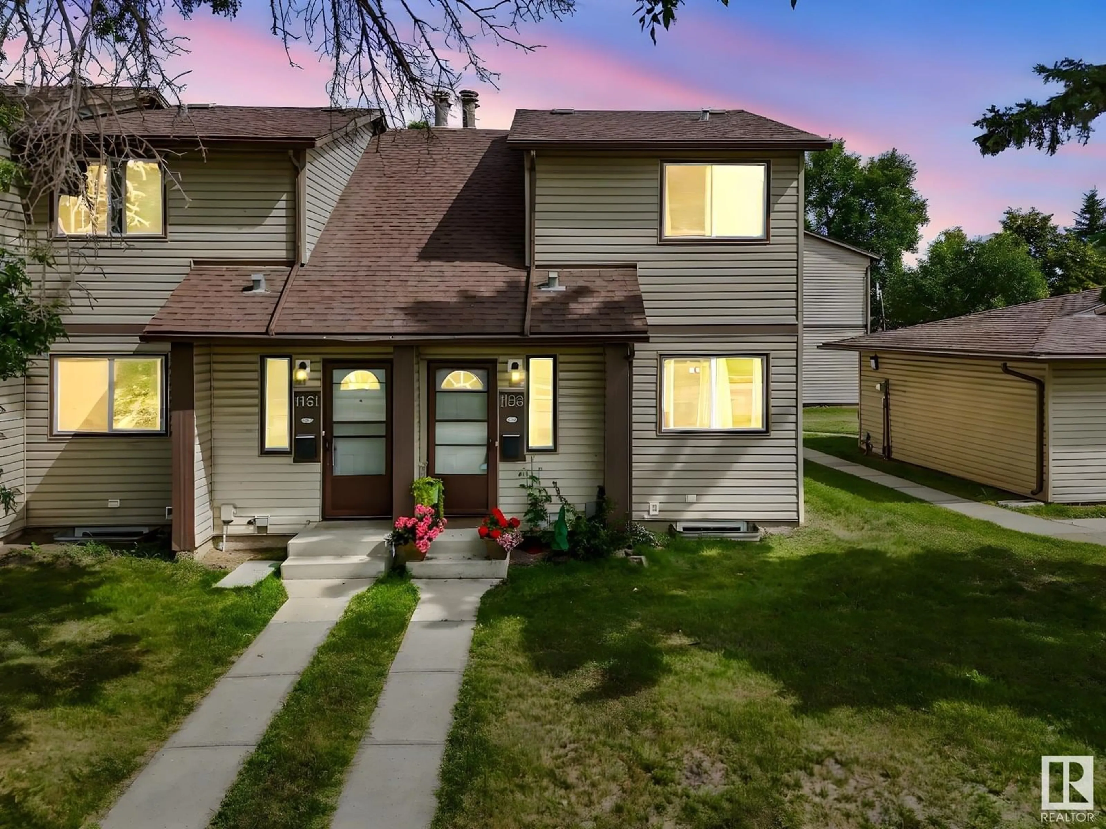 Home with vinyl exterior material, street for 1159 HOOKE RD, Edmonton Alberta T5A4A5
