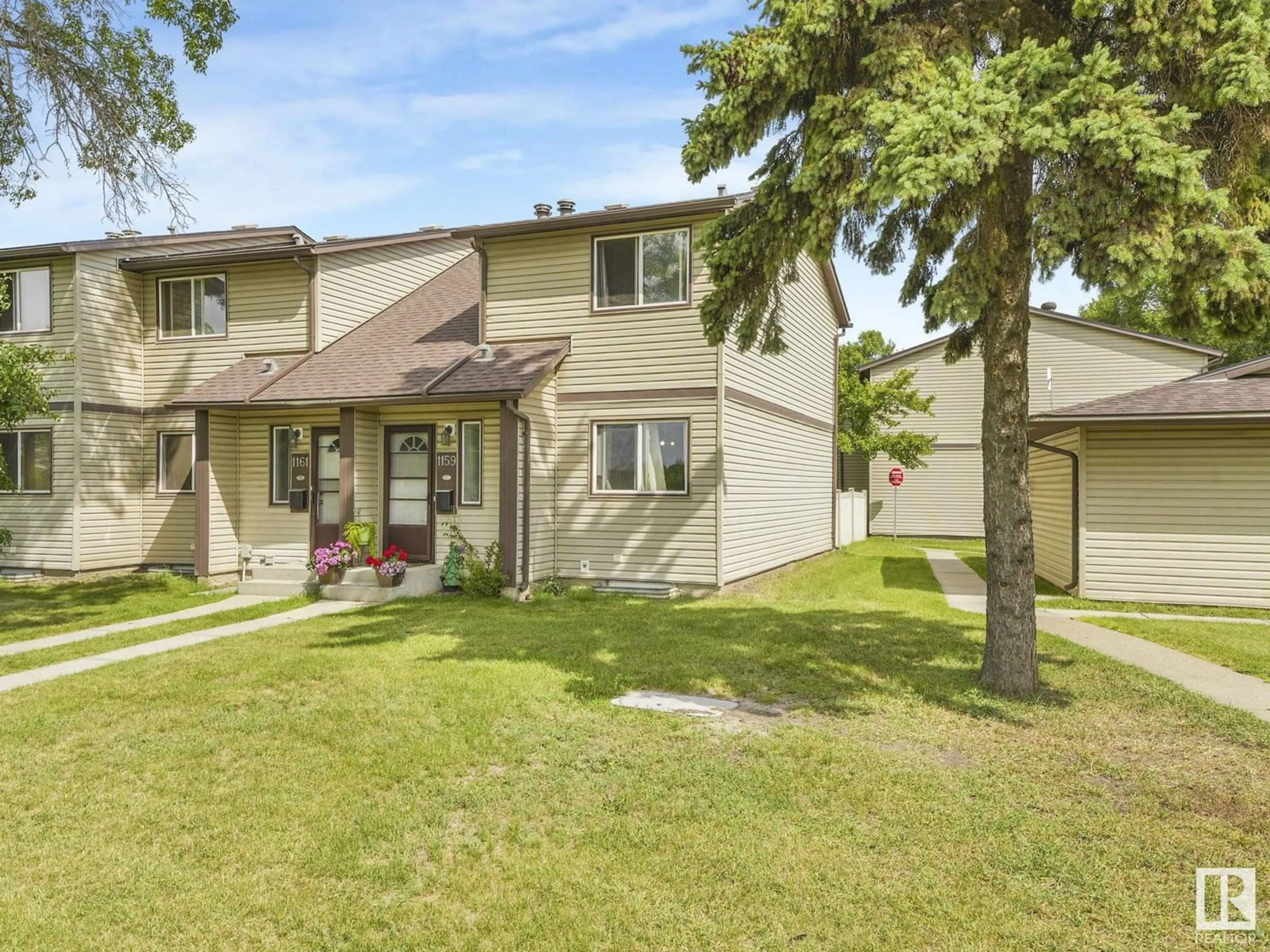 Home with vinyl exterior material, street for 1159 HOOKE RD, Edmonton Alberta T5A4A5