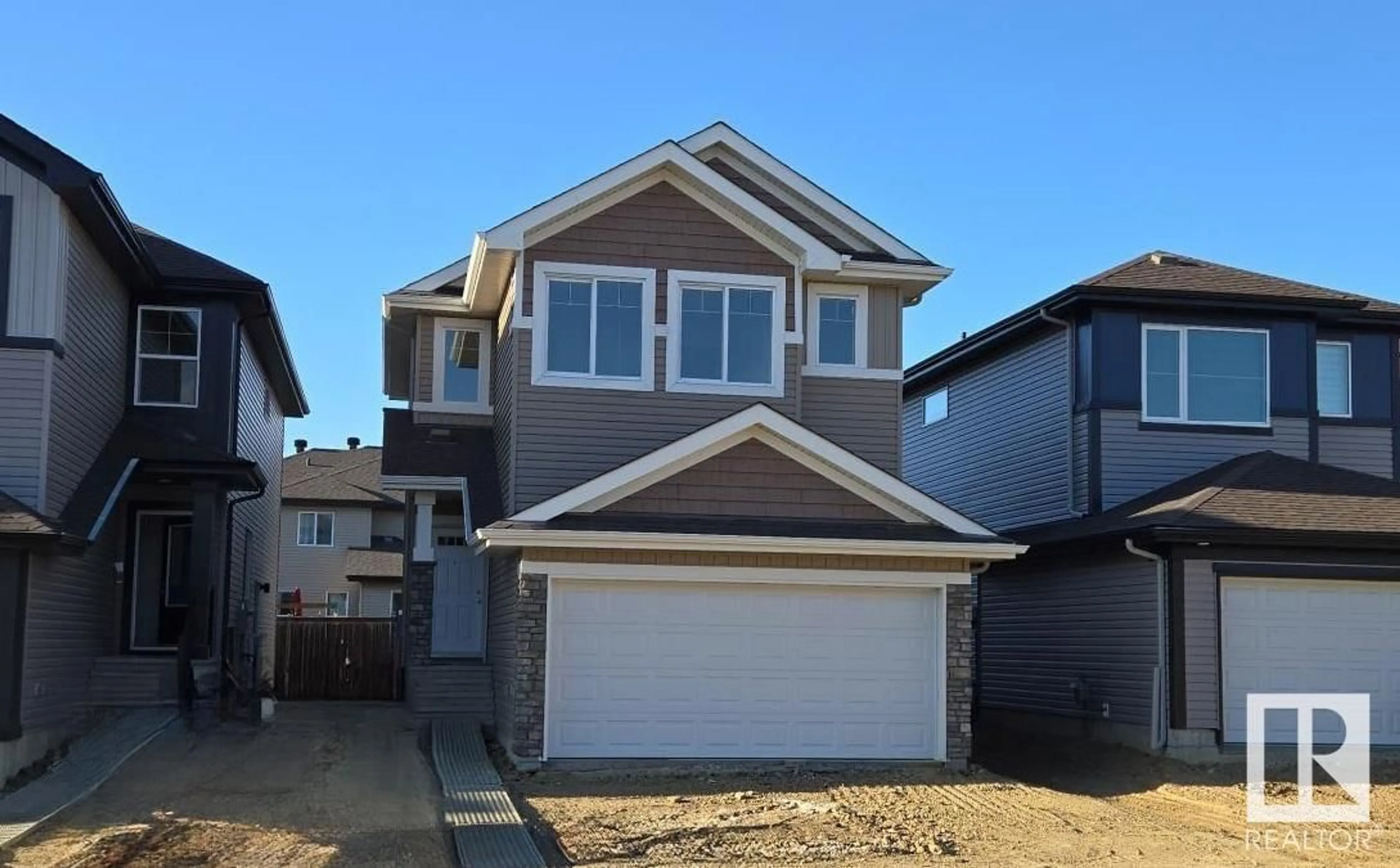 Home with vinyl exterior material, street for 18 SPRINGBROOK WD, Spruce Grove Alberta T7X2W5