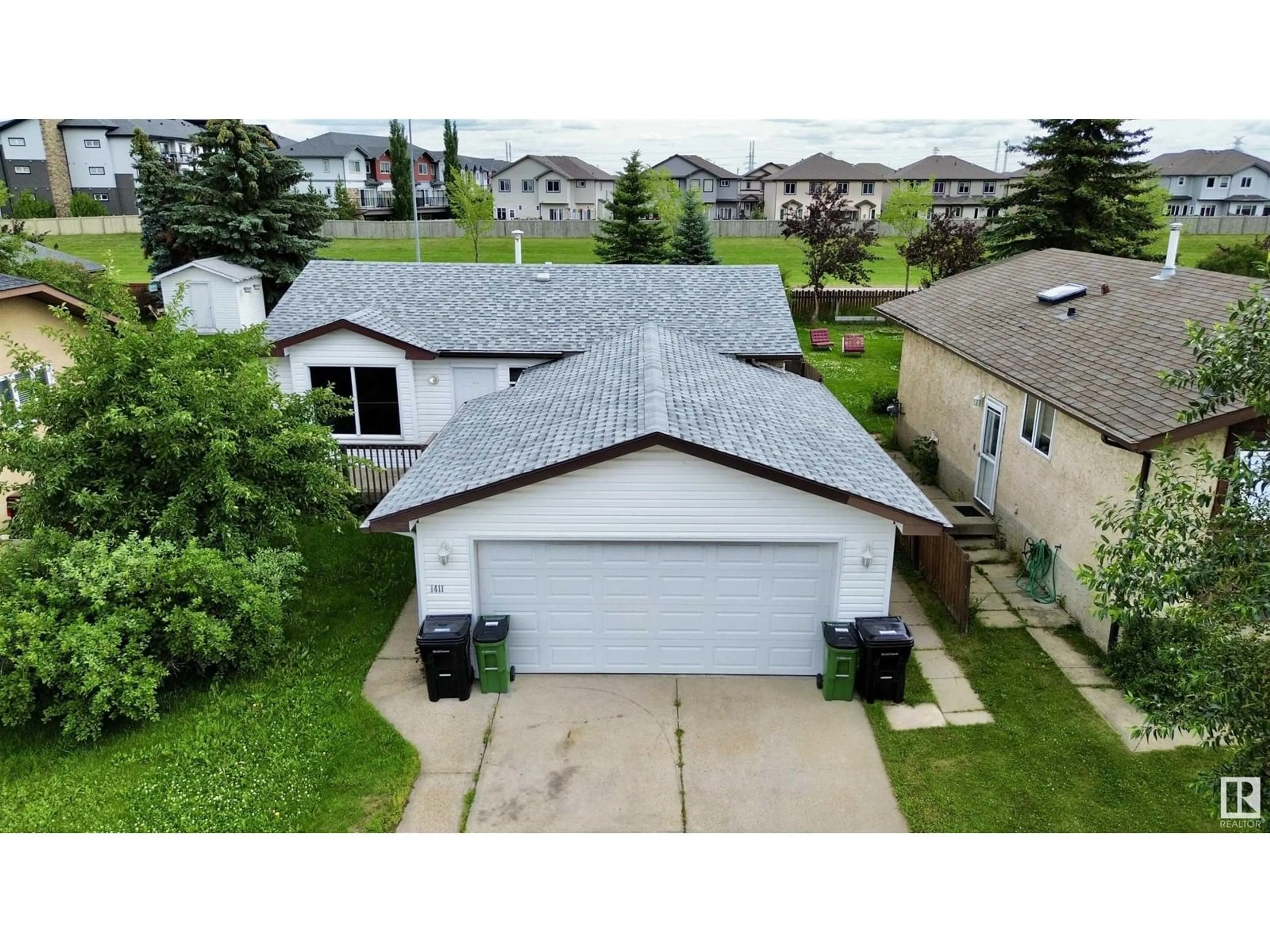 A pic from outside/outdoor area/front of a property/back of a property/a pic from drone, street for 1411 35 ST, Edmonton Alberta T6L2M2