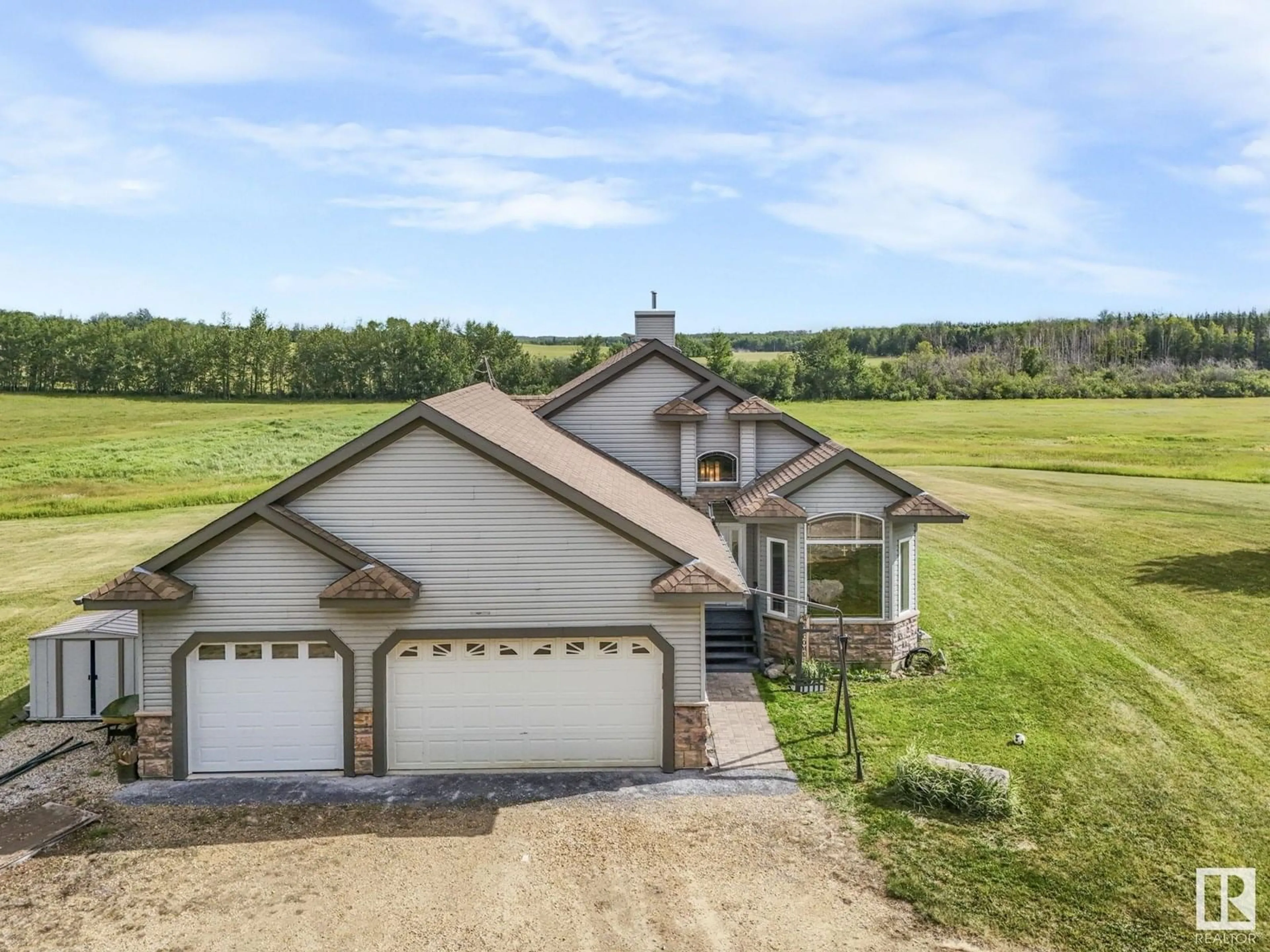 A pic from outside/outdoor area/front of a property/back of a property/a pic from drone, water/lake/river/ocean view for 260 21539 TWP ROAD 503, Rural Leduc County Alberta T0B3M2