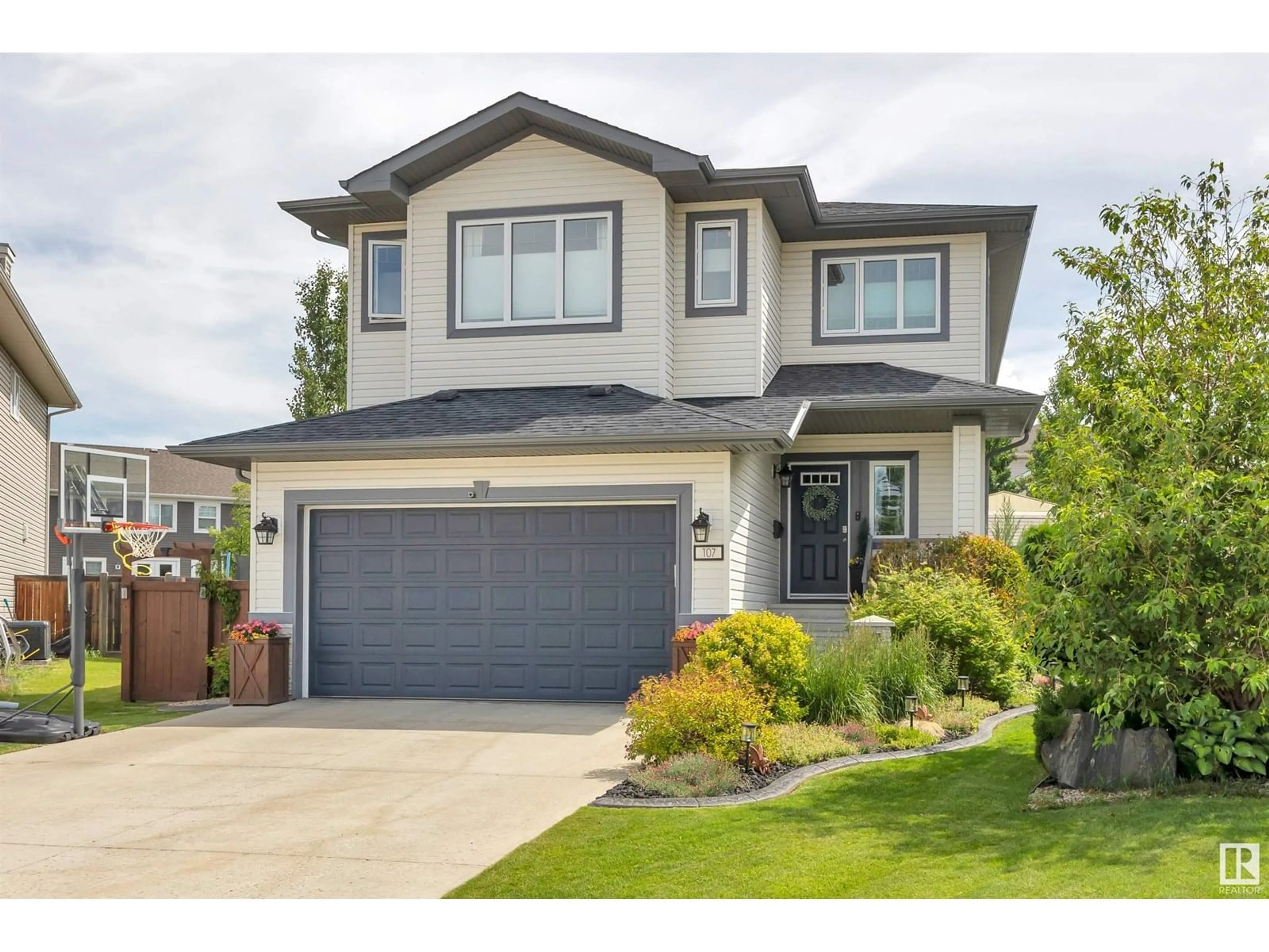 Home with vinyl exterior material, street for 107 RICARD PL, Beaumont Alberta T4X0B9