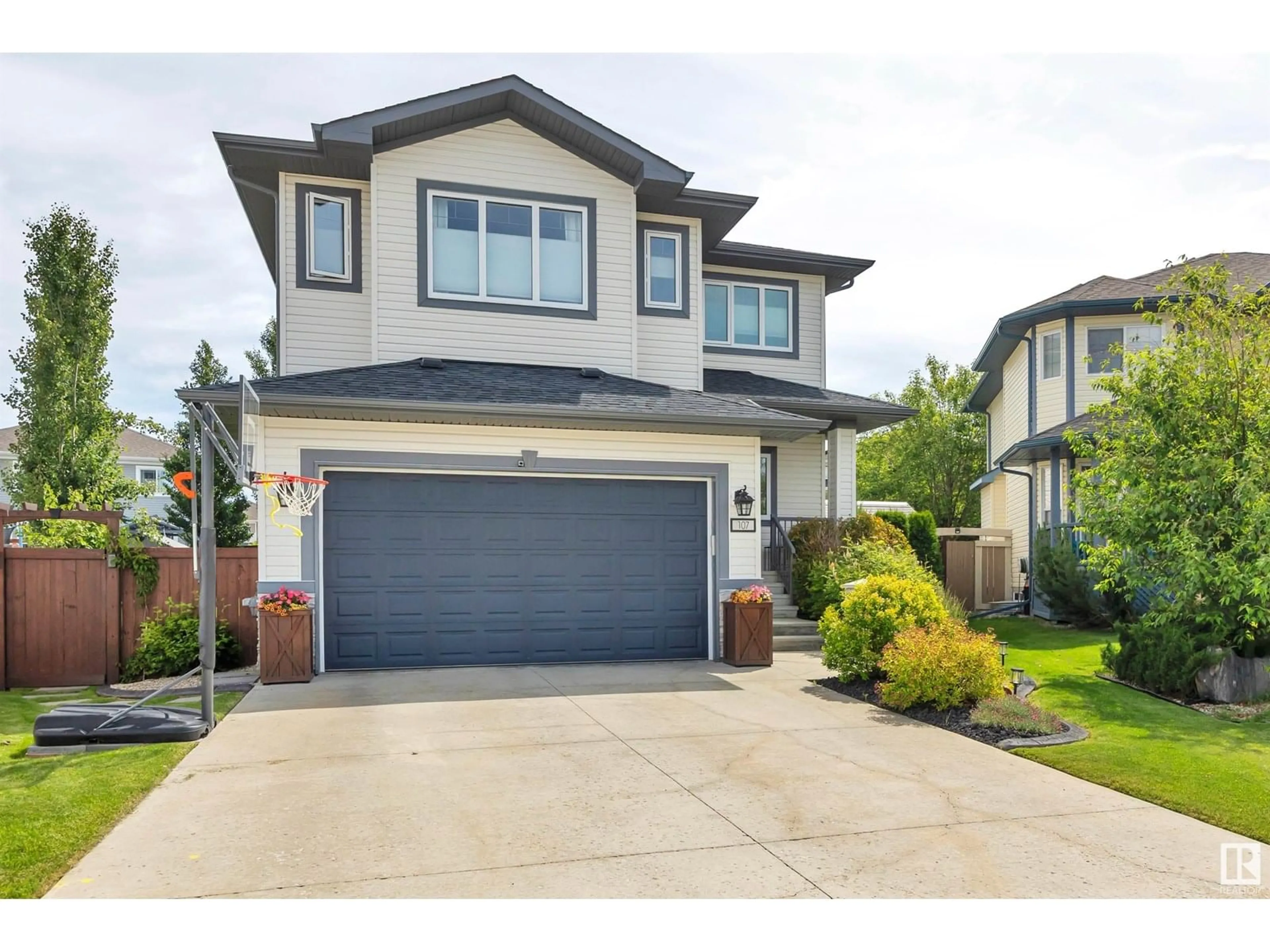 Home with vinyl exterior material, street for 107 RICARD PL, Beaumont Alberta T4X0B9