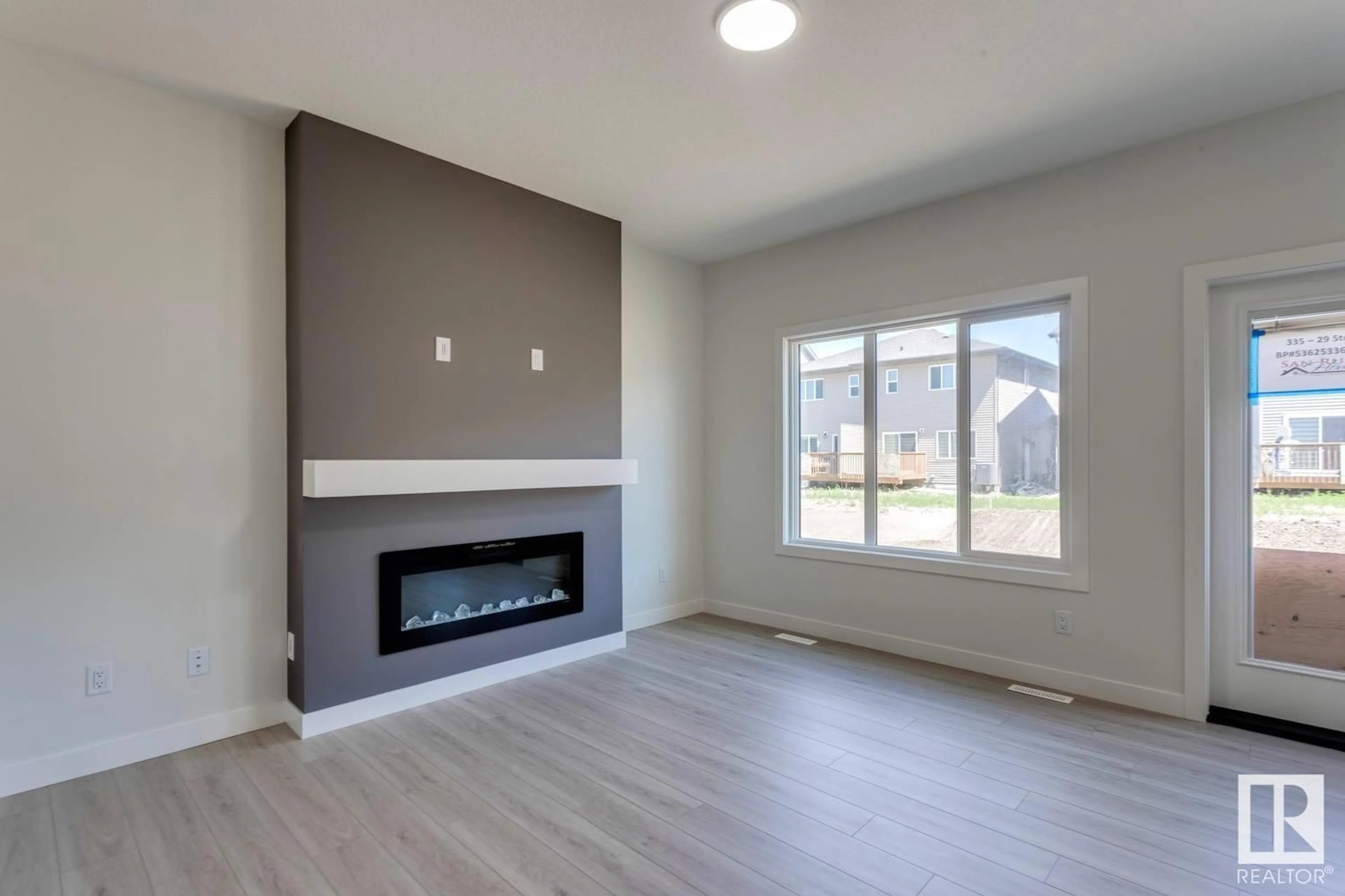 Living room with furniture, unknown for SW SW - 335 29 ST, Edmonton Alberta T6X3E7