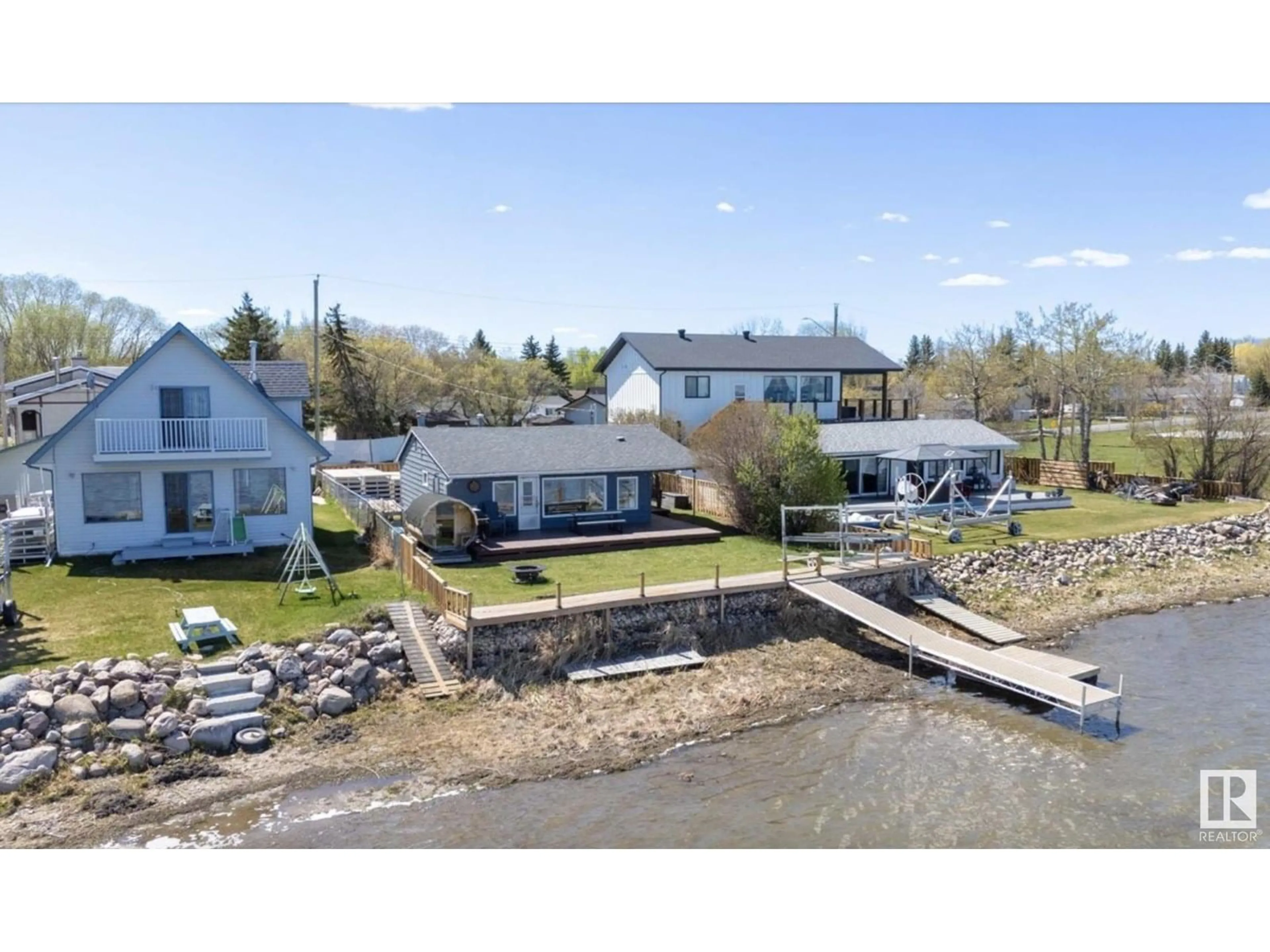 A pic from outside/outdoor area/front of a property/back of a property/a pic from drone, water/lake/river/ocean view for 6330 STE ANNE TRAIL, Rural Lac Ste. Anne County Alberta T0E0A0