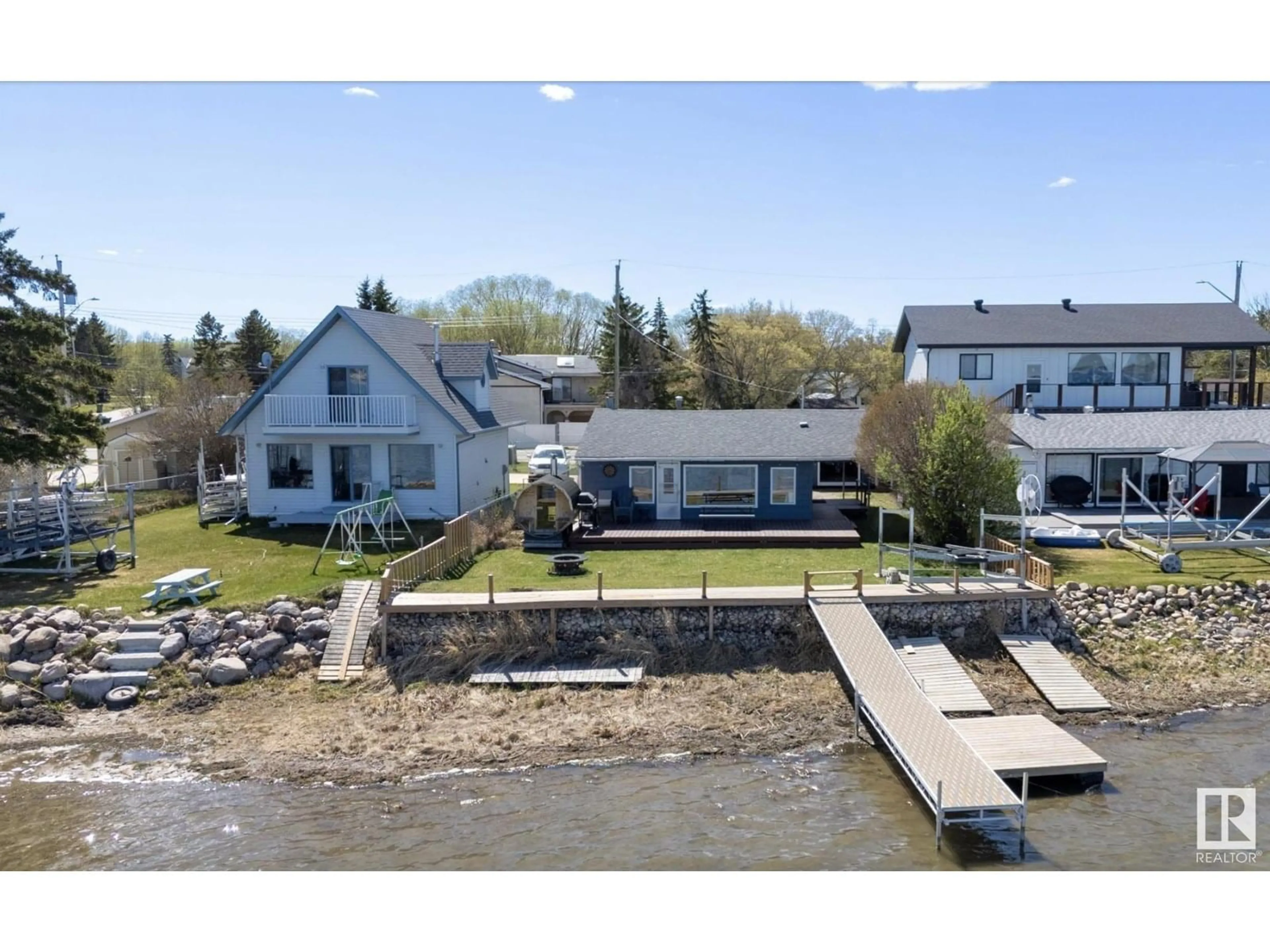 A pic from outside/outdoor area/front of a property/back of a property/a pic from drone, water/lake/river/ocean view for 6330 STE ANNE TRAIL, Rural Lac Ste. Anne County Alberta T0E0A0