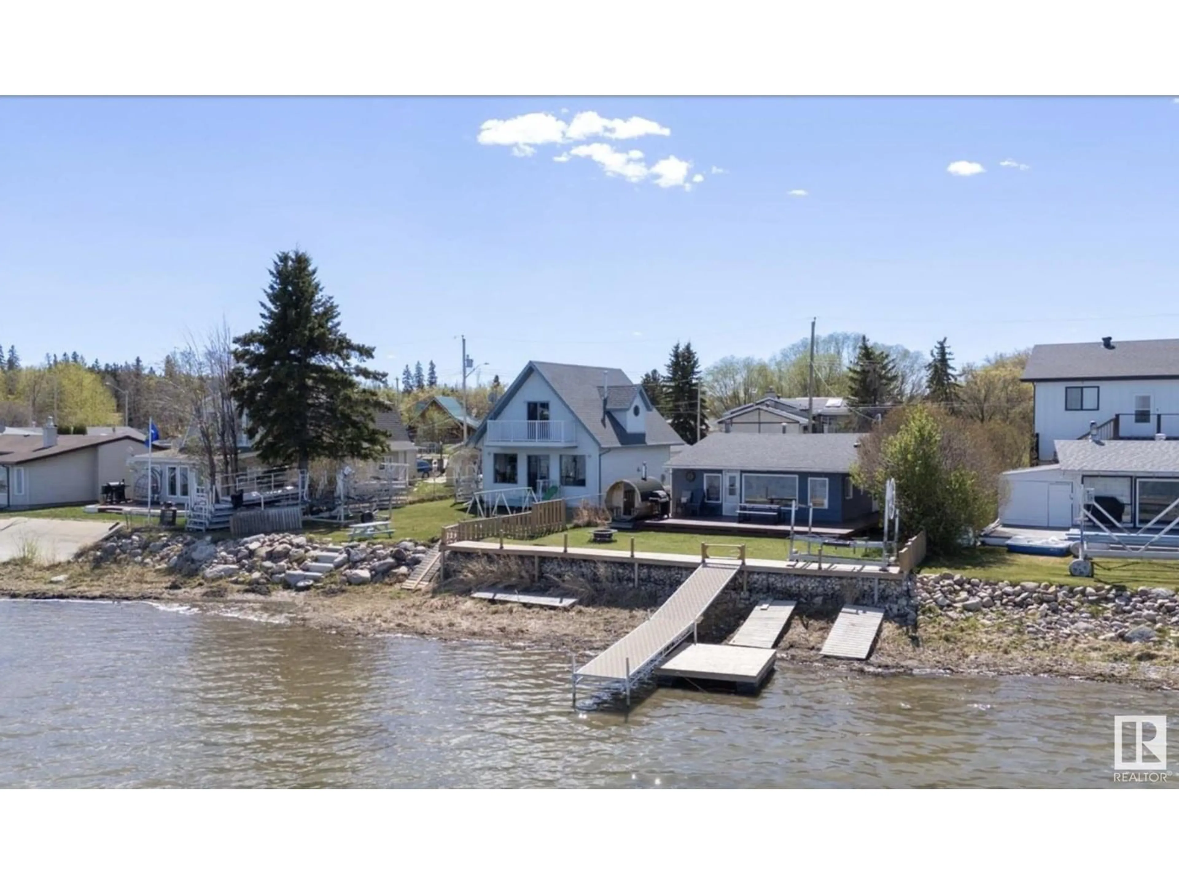 A pic from outside/outdoor area/front of a property/back of a property/a pic from drone, water/lake/river/ocean view for 6330 STE ANNE TRAIL, Rural Lac Ste. Anne County Alberta T0E0A0