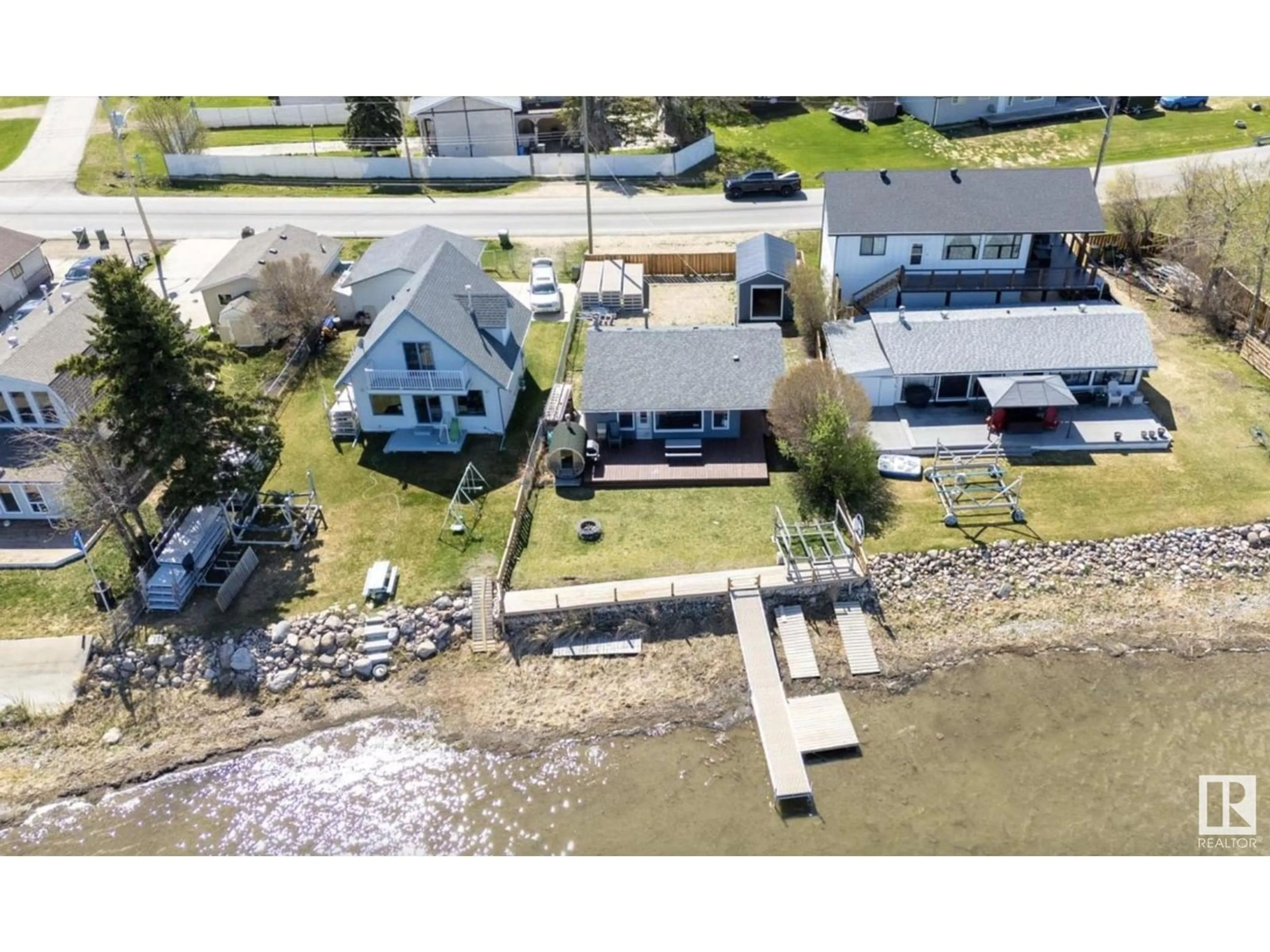 A pic from outside/outdoor area/front of a property/back of a property/a pic from drone, water/lake/river/ocean view for 6330 STE ANNE TRAIL, Rural Lac Ste. Anne County Alberta T0E0A0
