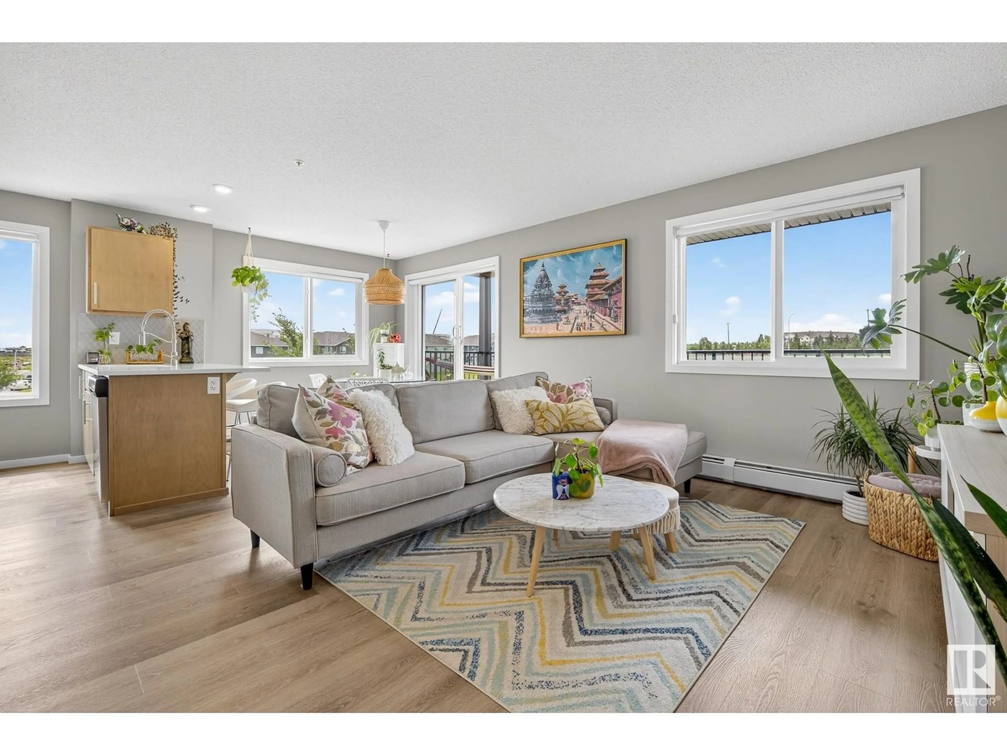 Living room with furniture, wood/laminate floor for 237 EBBERS BV, Edmonton Alberta T5Y4A4