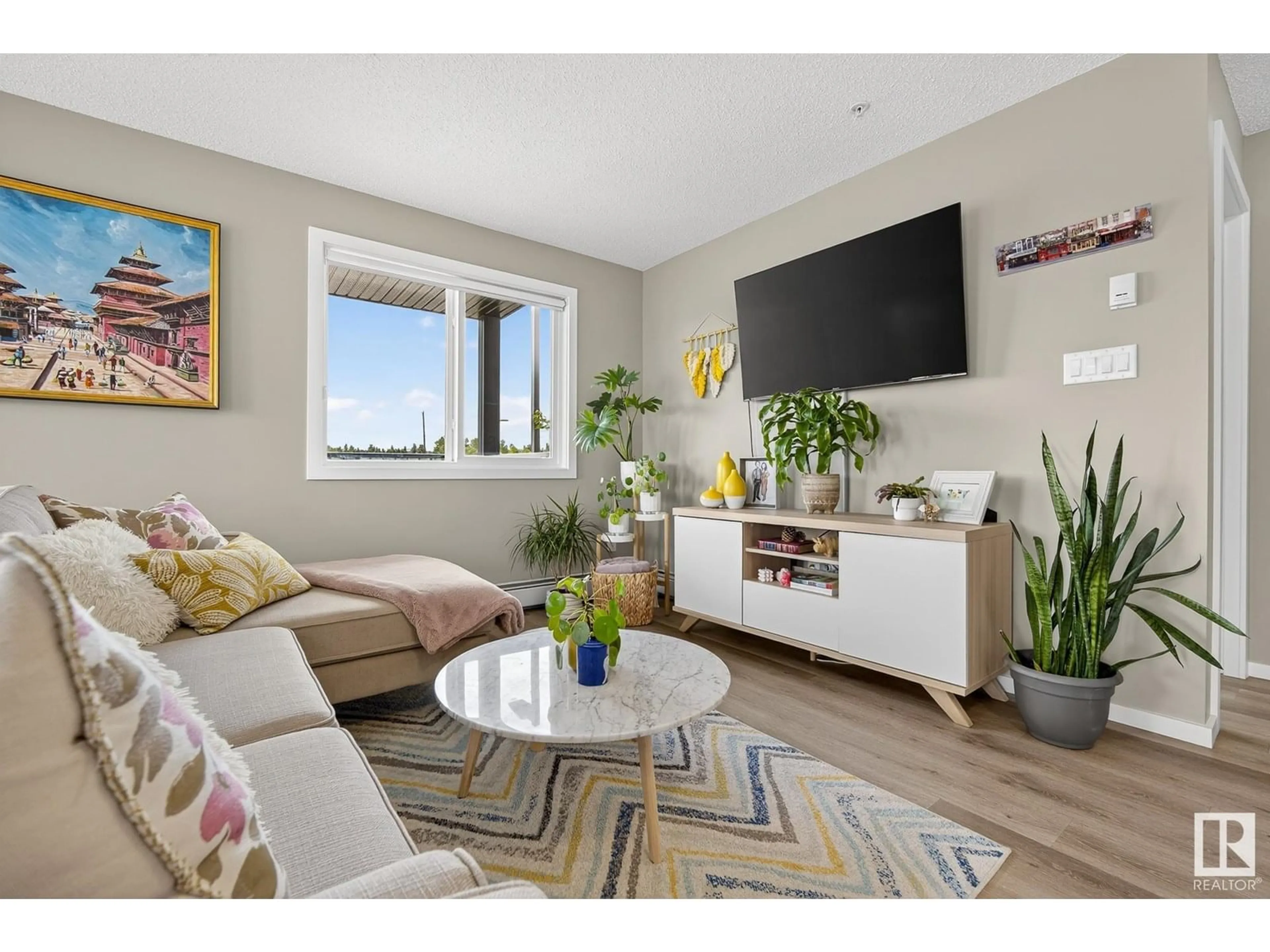 Living room with furniture, wood/laminate floor for 237 EBBERS BV, Edmonton Alberta T5Y4A4