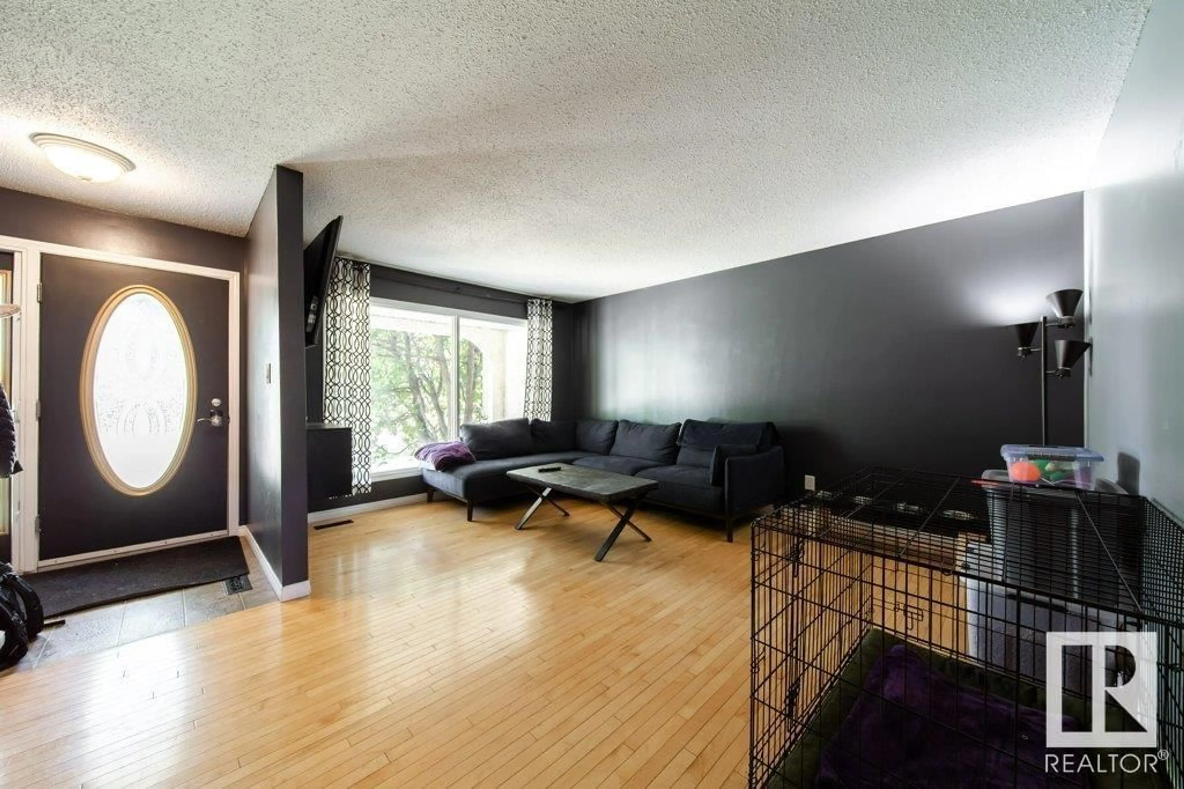 Living room with furniture, wood/laminate floor for 9604 82 ST, Fort Saskatchewan Alberta T8L3J2