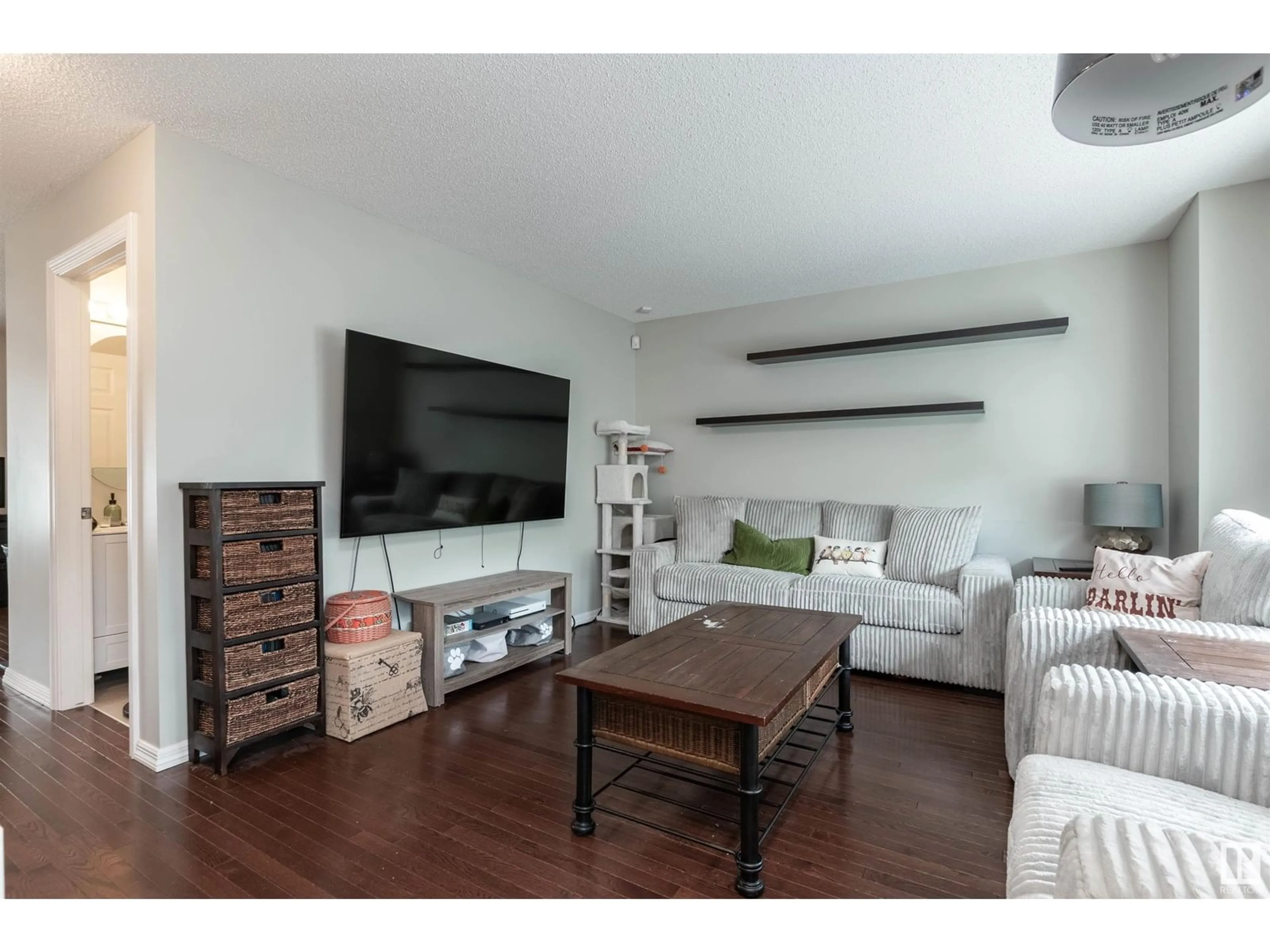 Living room with furniture, wood/laminate floor for 30 - 2336 ASPEN TR, Sherwood Park Alberta T8H0J1