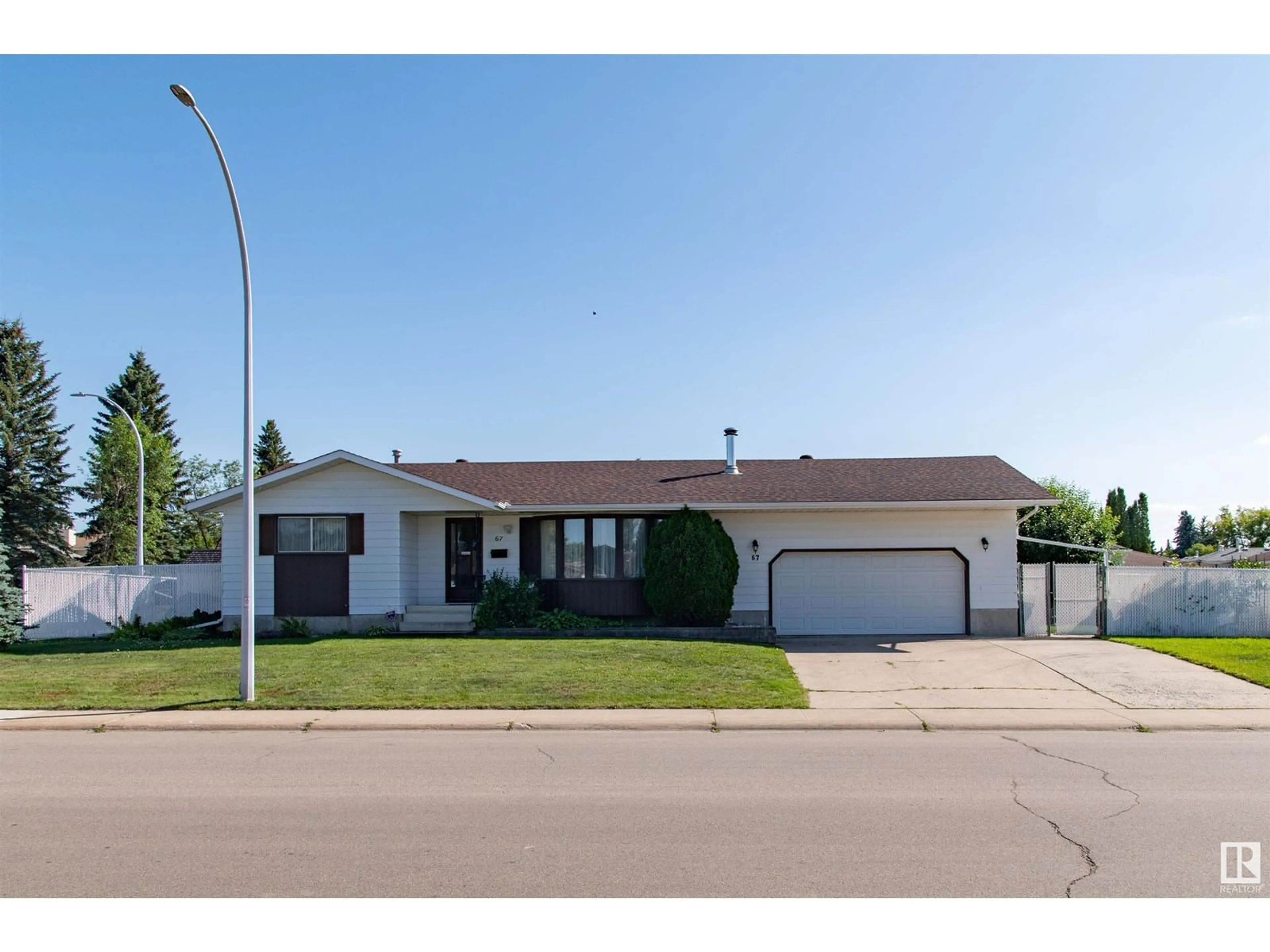 Home with vinyl exterior material, street for 67 ALEXANDER DR, Leduc Alberta T9E5G5