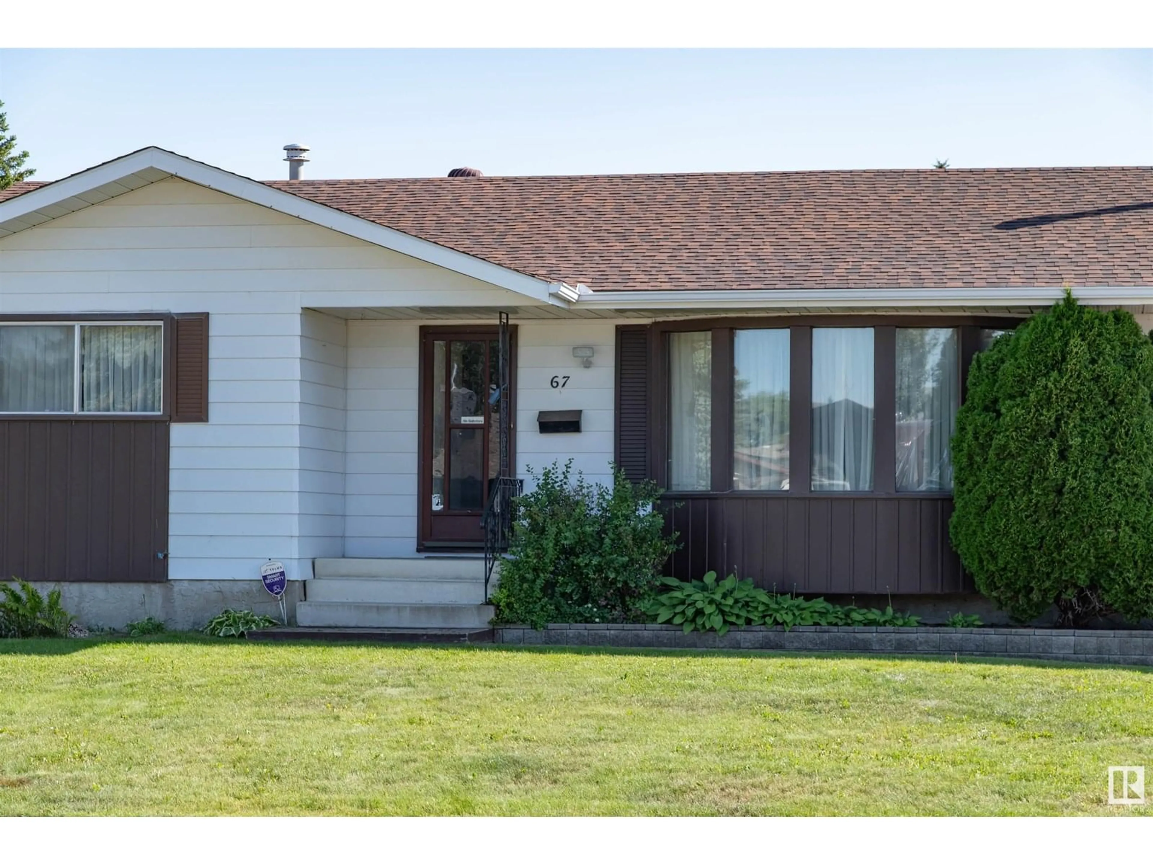 Home with vinyl exterior material, street for 67 ALEXANDER DR, Leduc Alberta T9E5G5