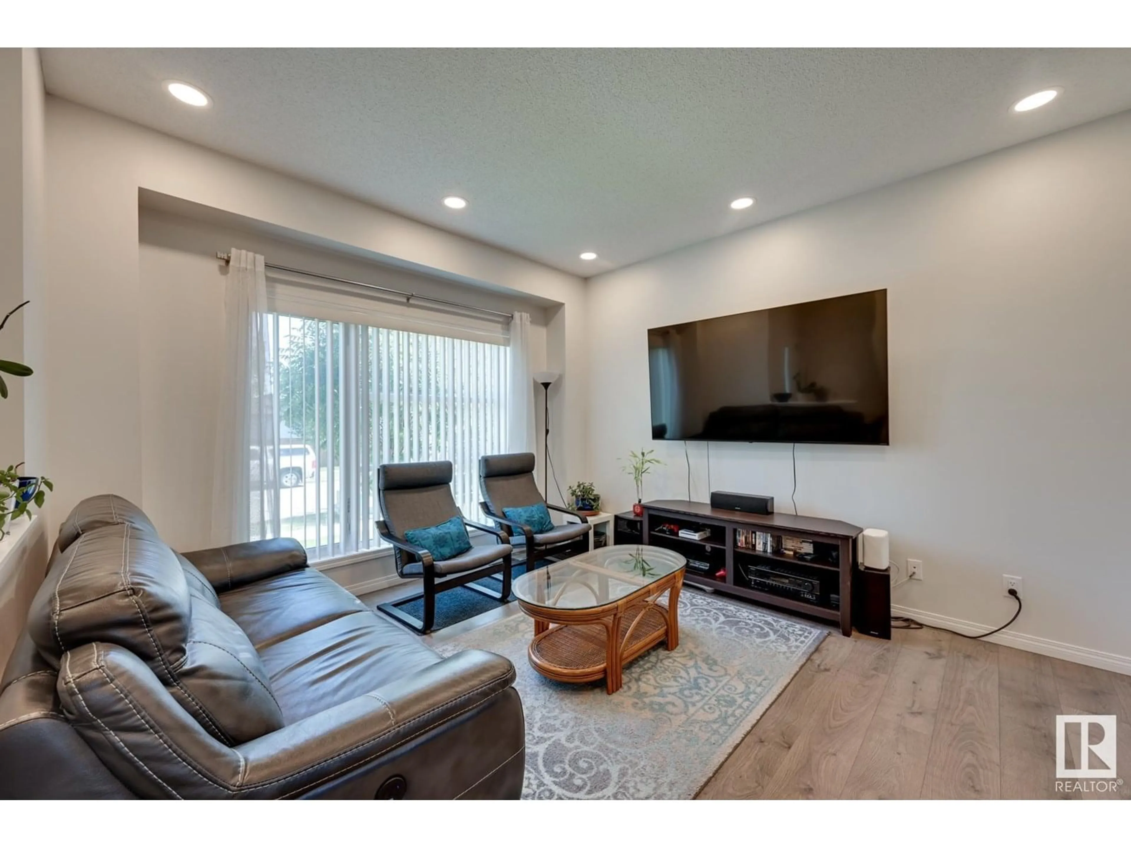Living room with furniture, wood/laminate floor for 2359 CASEY CR, Edmonton Alberta T6W3N1