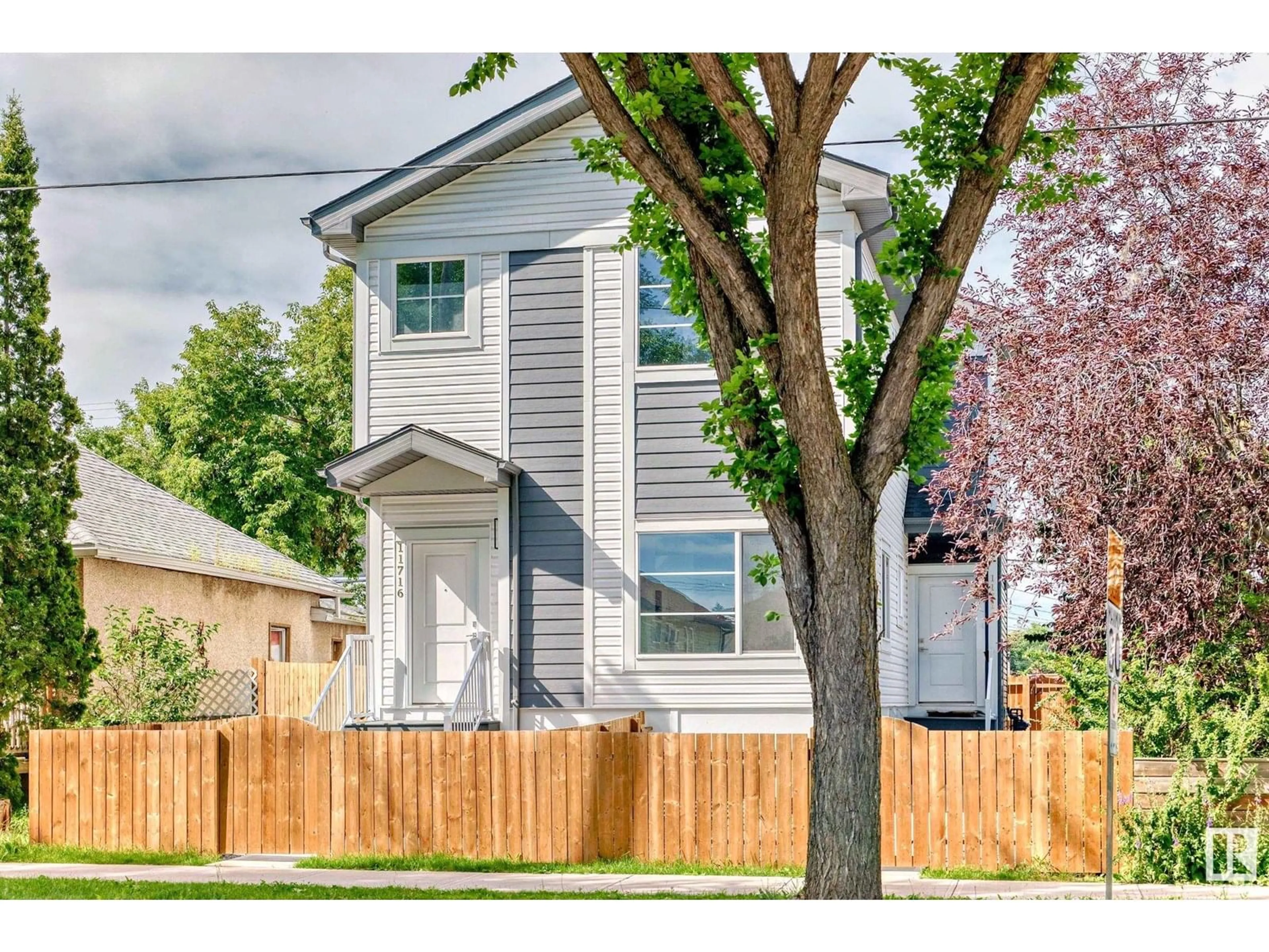 Home with vinyl exterior material, street for 11716 129 AV, Edmonton Alberta T5E0M8