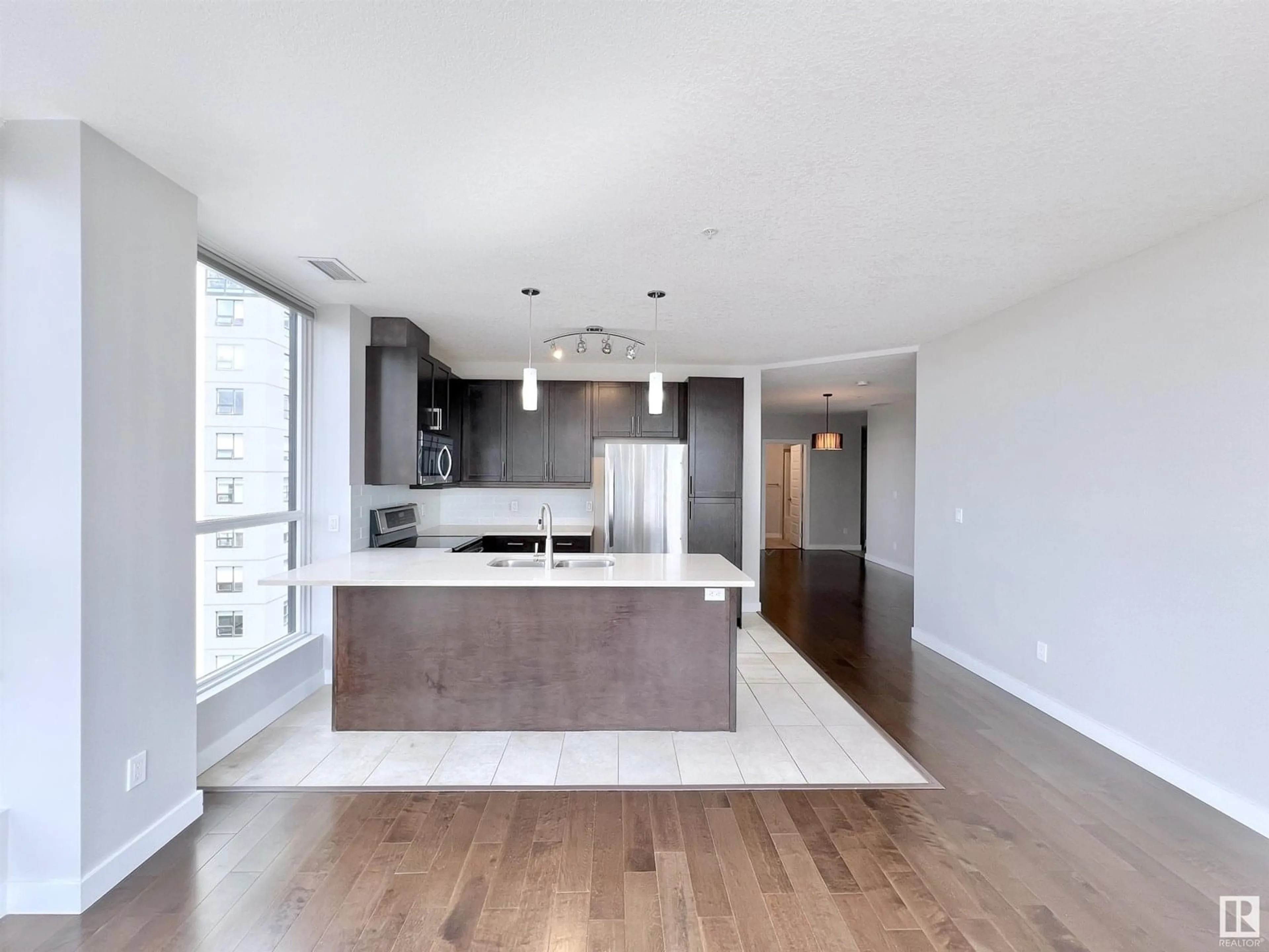 Open concept kitchen, wood/laminate floor for 5151 - 616 WINDERMERE BV, Edmonton Alberta T6W2K4
