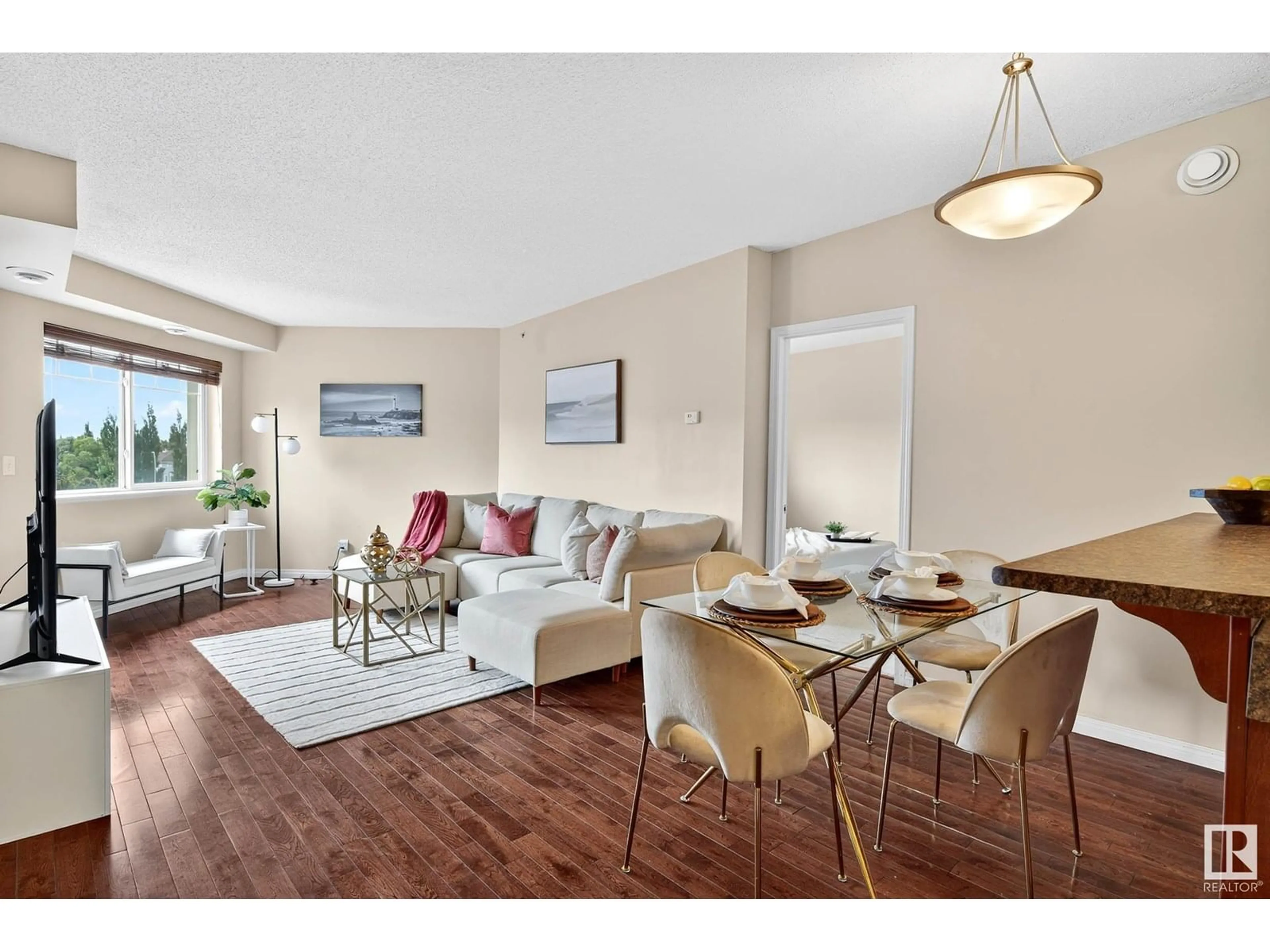 Living room with furniture, wood/laminate floor for #401 - 6925 199 ST NW, Edmonton Alberta T5T3X8