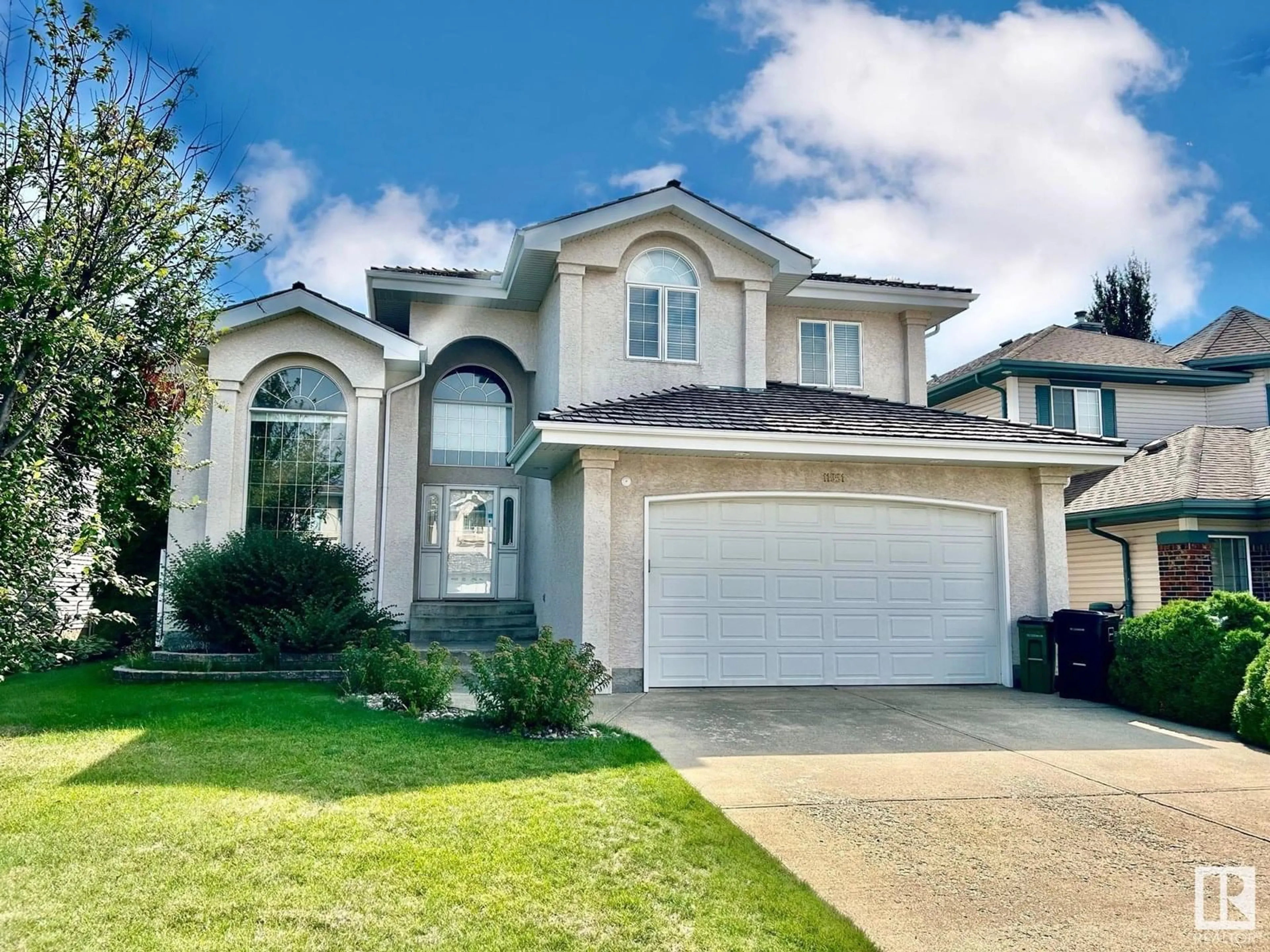 Home with vinyl exterior material, street for 11551 14 AV, Edmonton Alberta T6J7B3