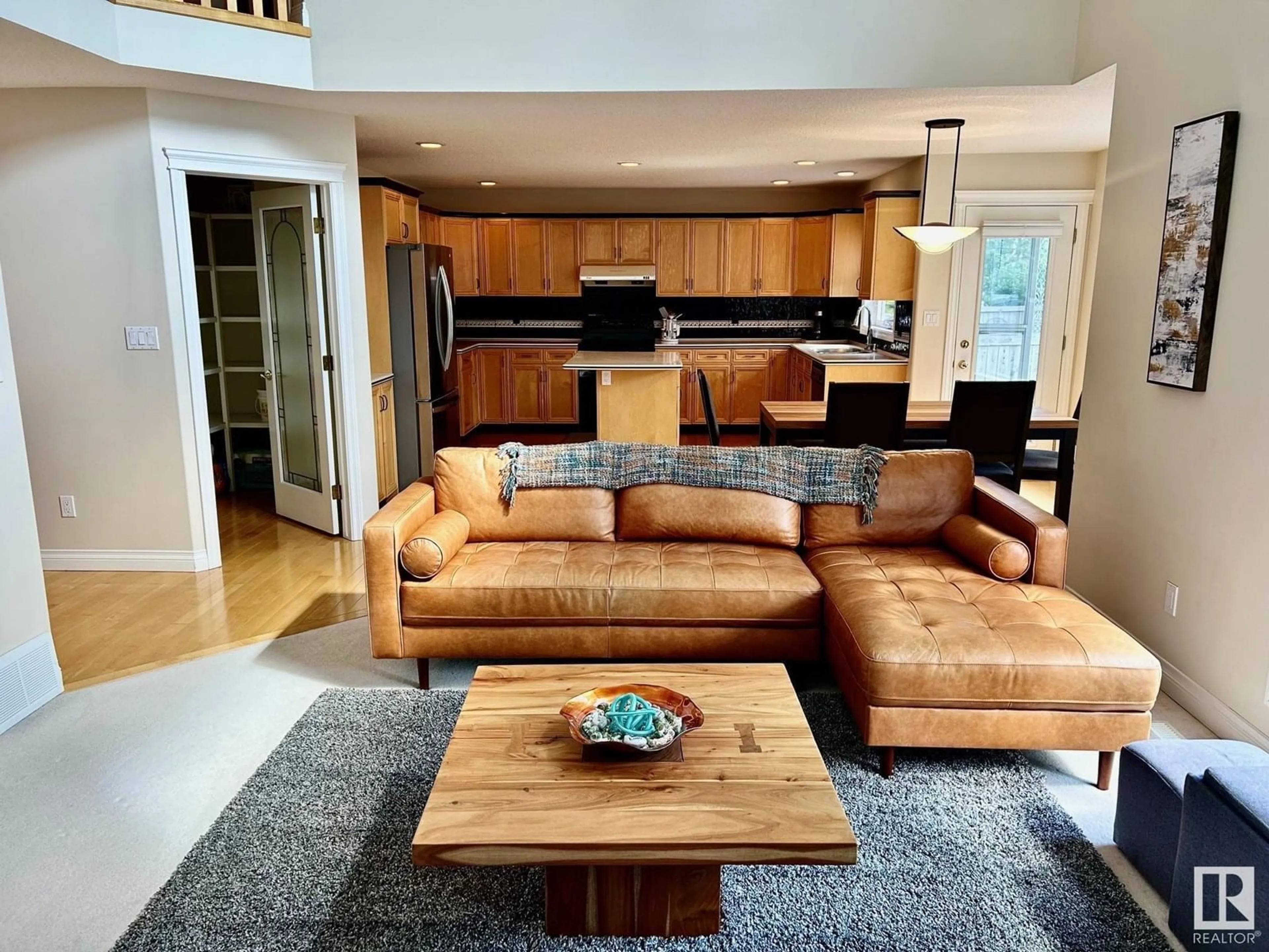 Living room with furniture, wood/laminate floor for 11551 14 AV, Edmonton Alberta T6J7B3