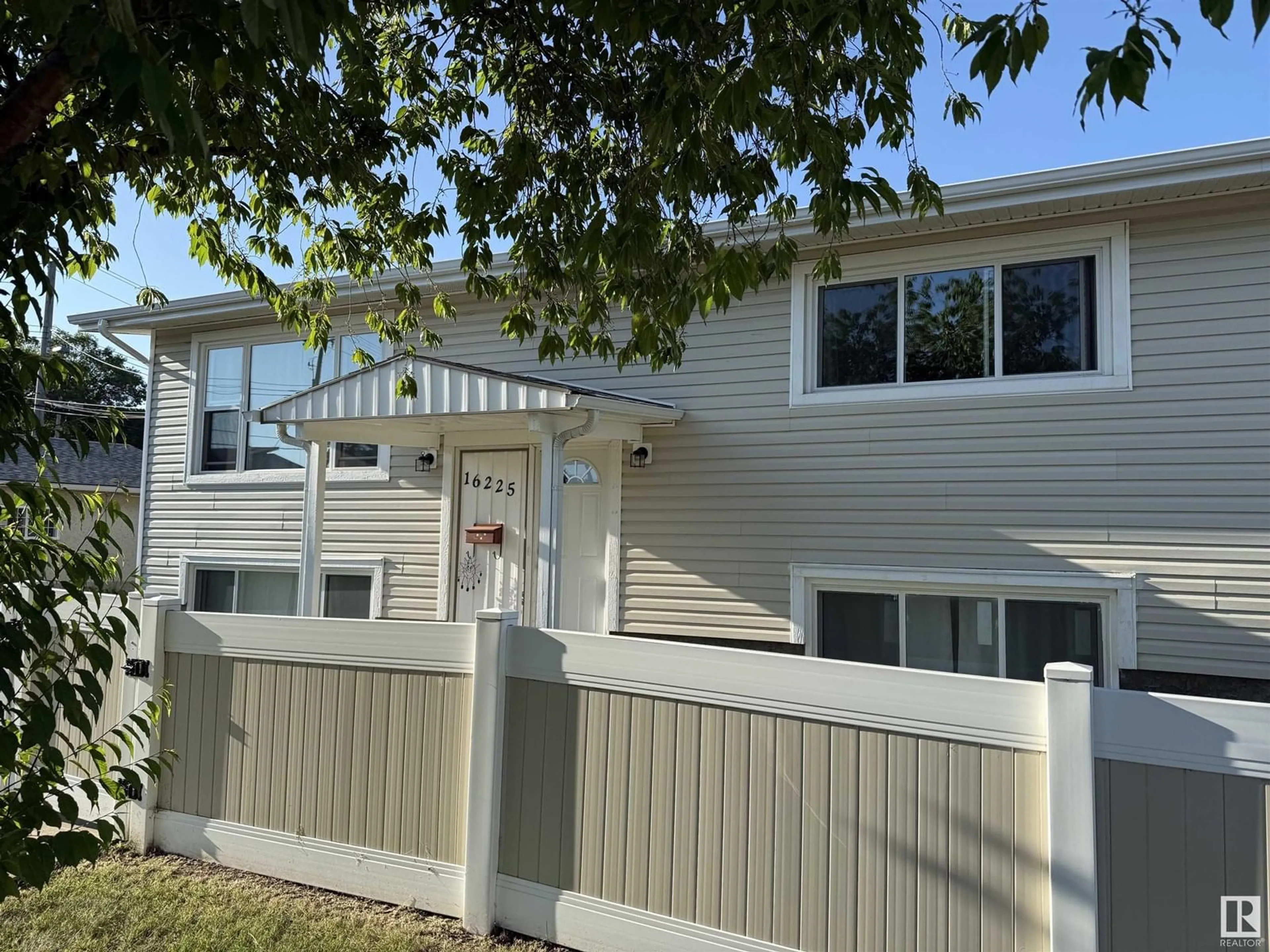 Home with vinyl exterior material, street for 16225 102 AV, Edmonton Alberta T5P4G6