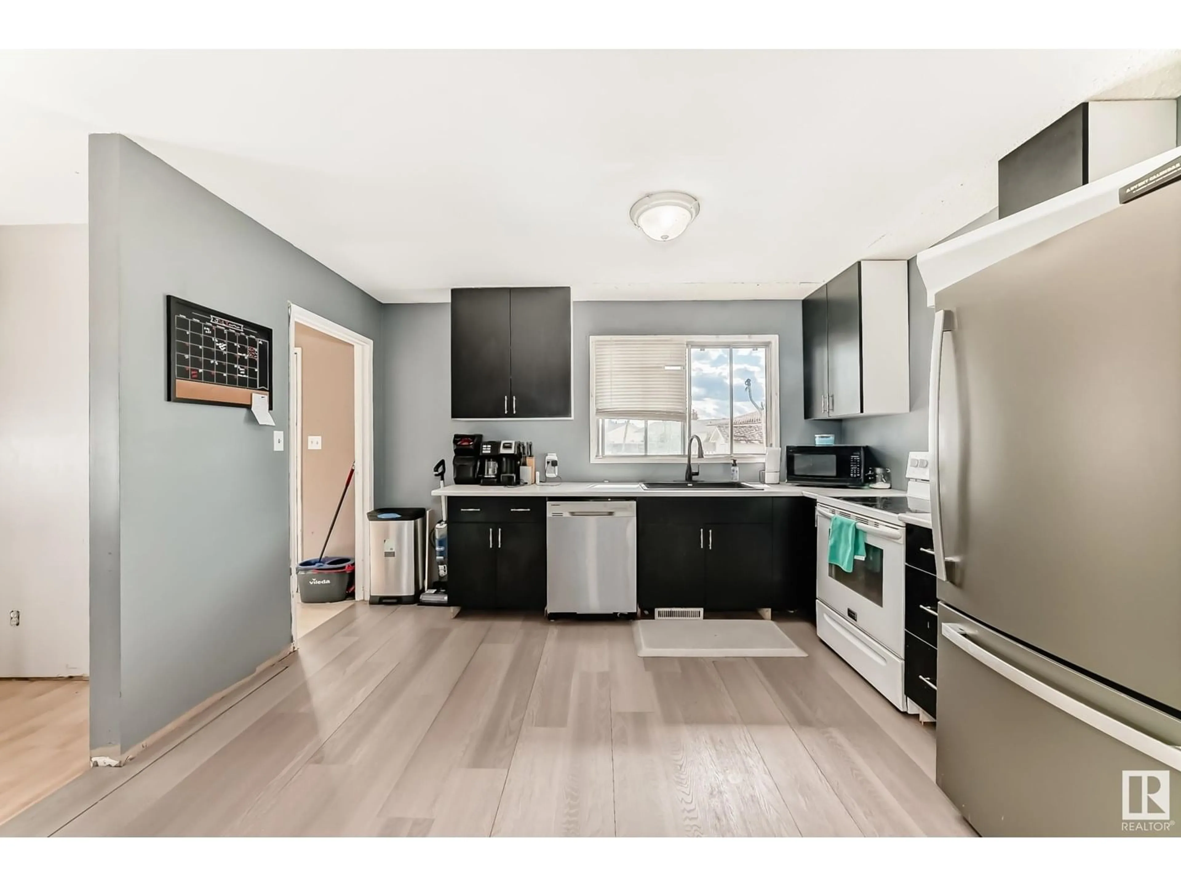 Open concept kitchen, wood/laminate floor for 5044 45 ST, Lamont Alberta T0B2R0