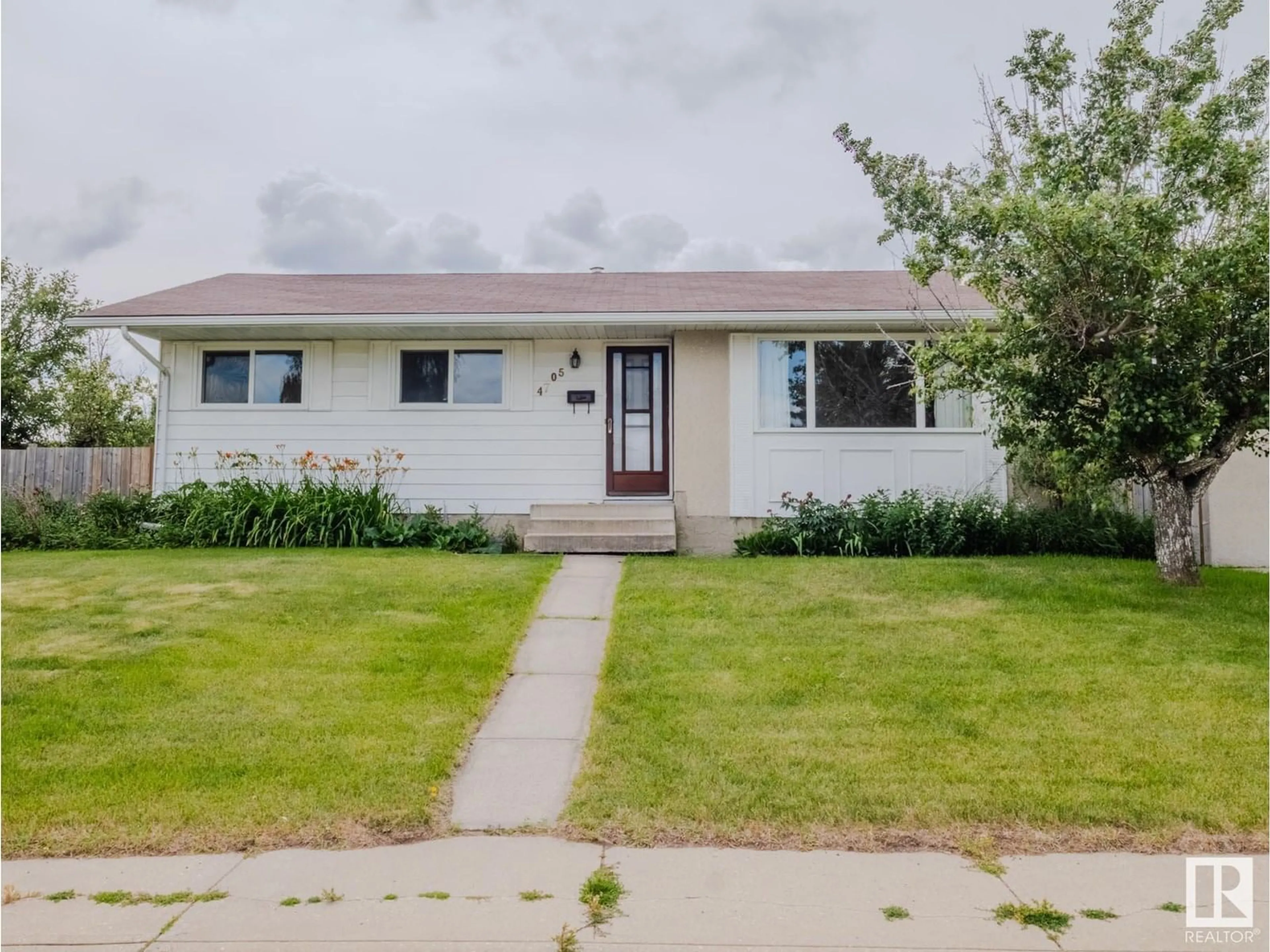 Home with vinyl exterior material, street for 4705 128A AV, Edmonton Alberta T5A2J4