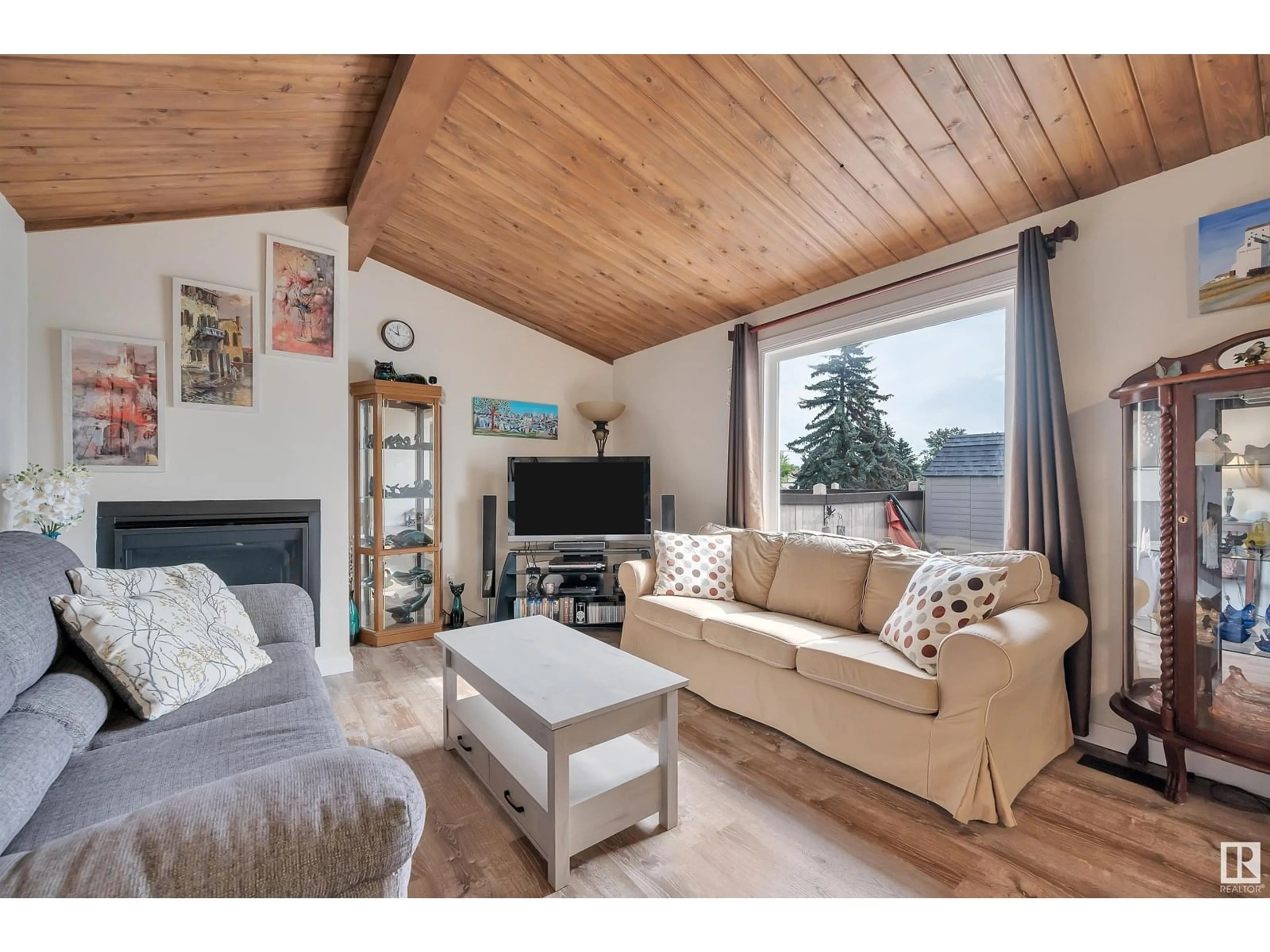 Living room with furniture, wood/laminate floor for #214 - 214 MARLBOROUGH PL, Edmonton Alberta T5T1Y6