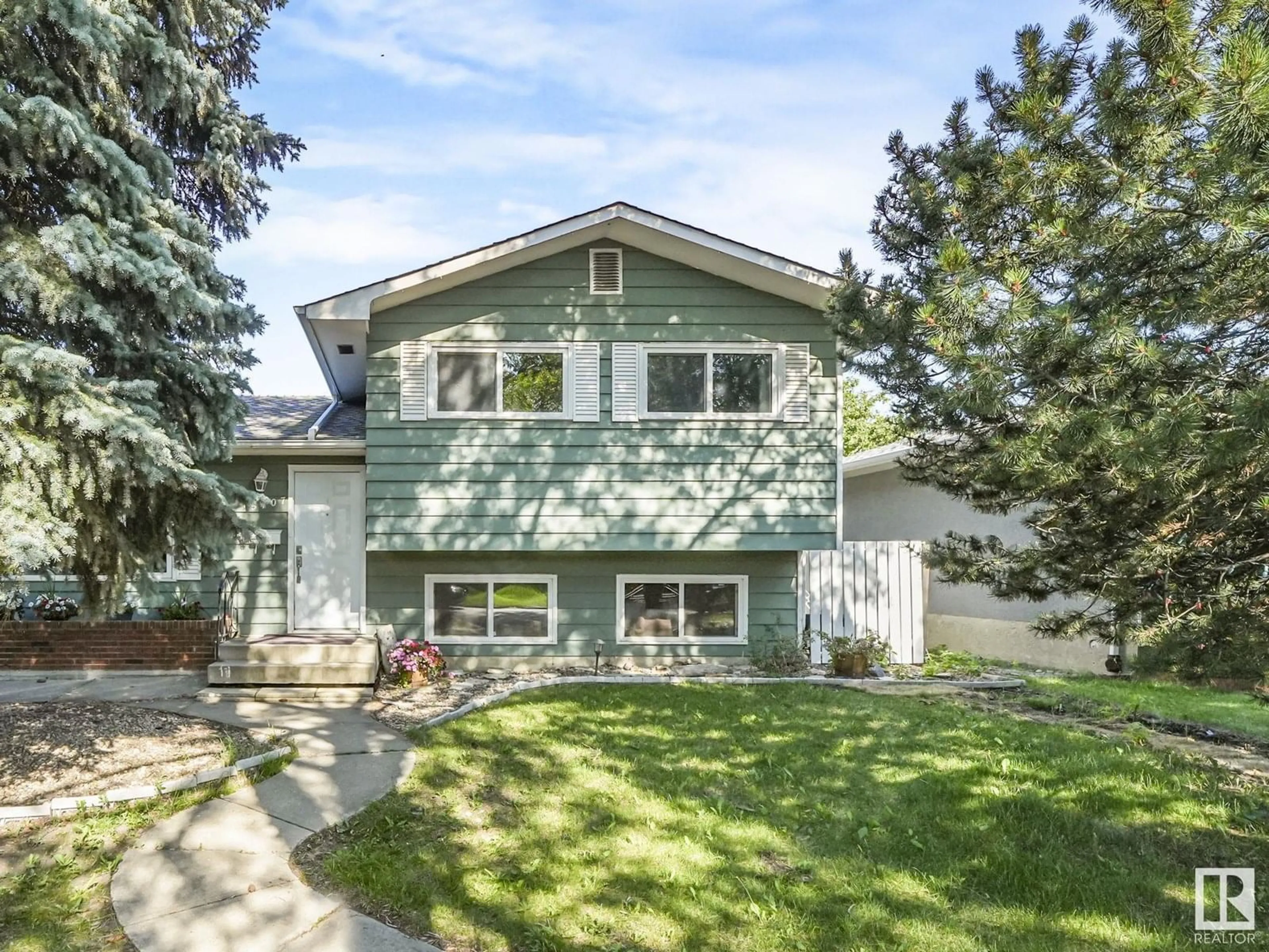 Home with vinyl exterior material, street for NW - 15107 65 ST, Edmonton Alberta T5A2E4