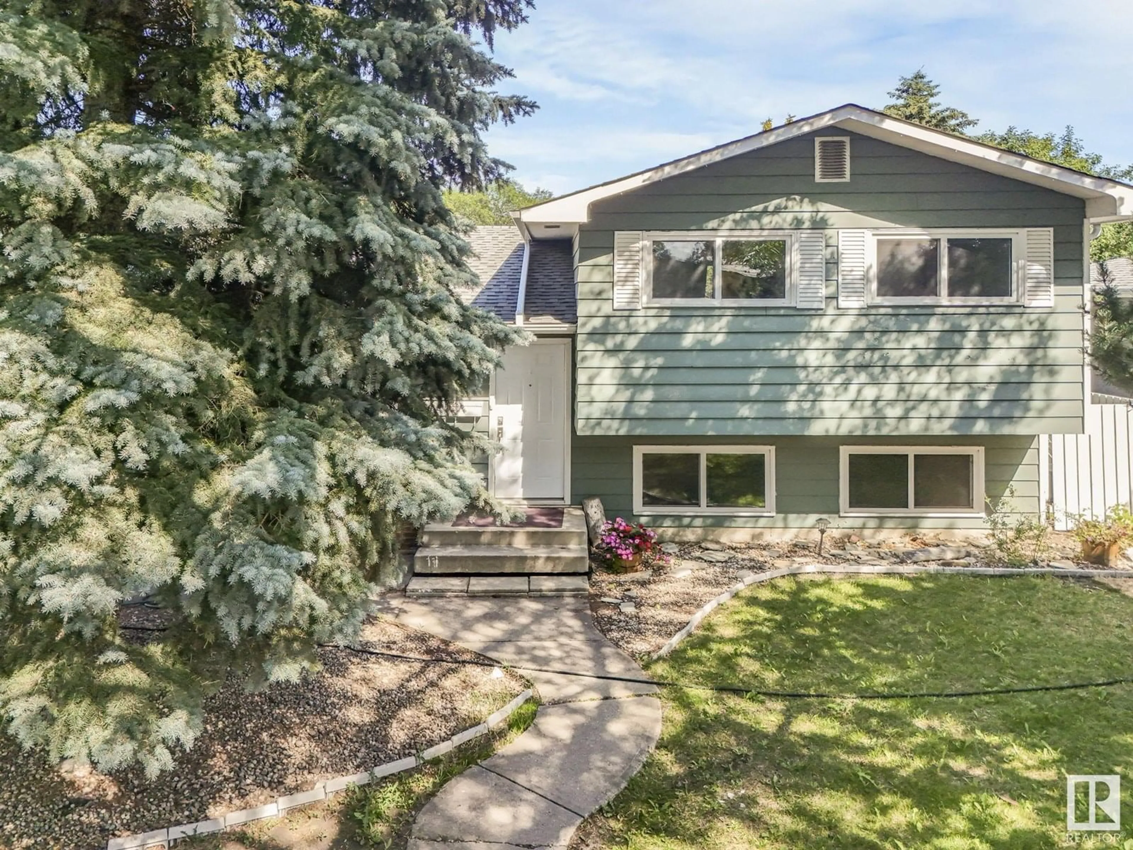Home with vinyl exterior material, street for NW - 15107 65 ST, Edmonton Alberta T5A2E4