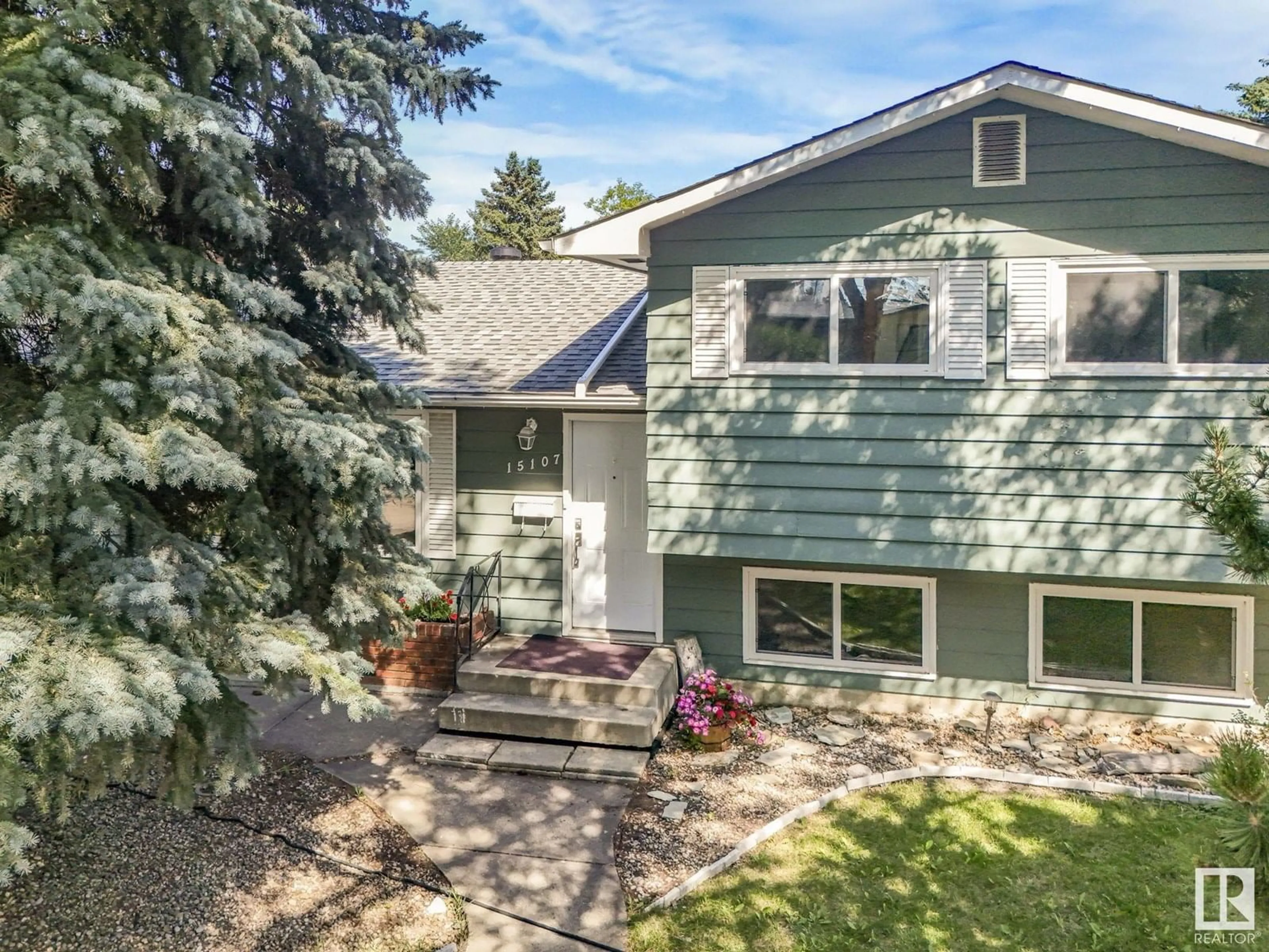 Home with vinyl exterior material, street for NW - 15107 65 ST, Edmonton Alberta T5A2E4