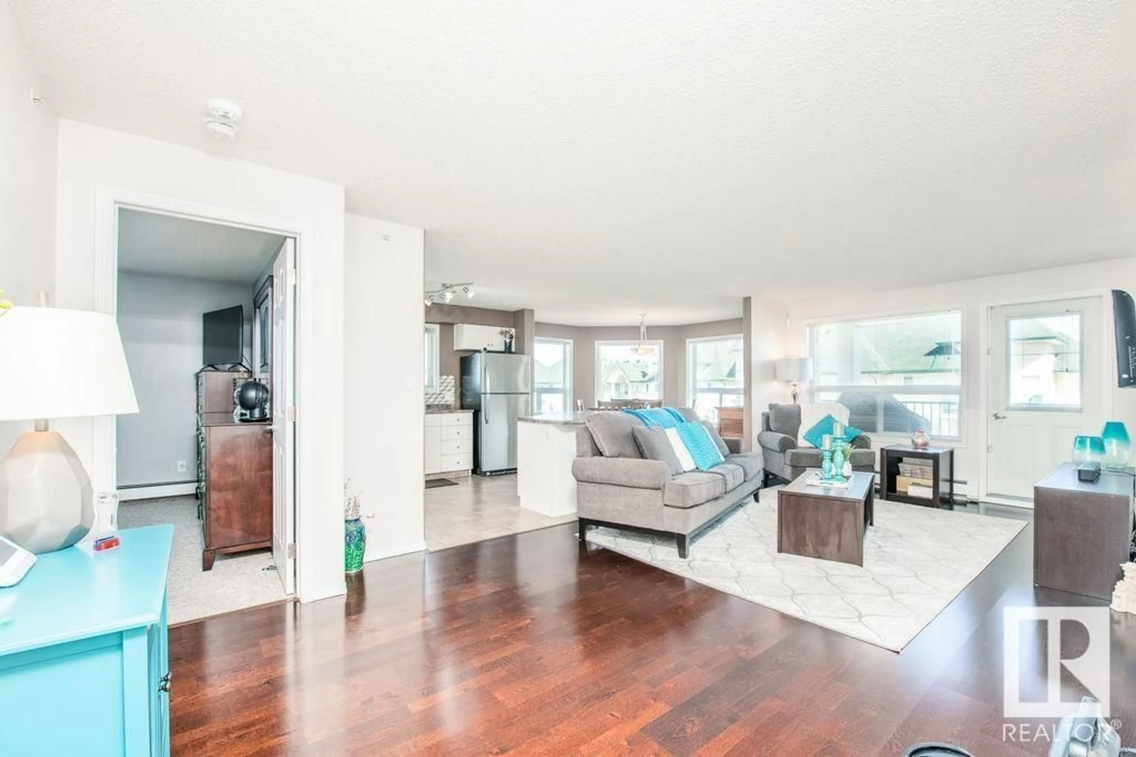 Living room with furniture, wood/laminate floor for #419 - 13625 34 ST, Edmonton Alberta T5A0E3