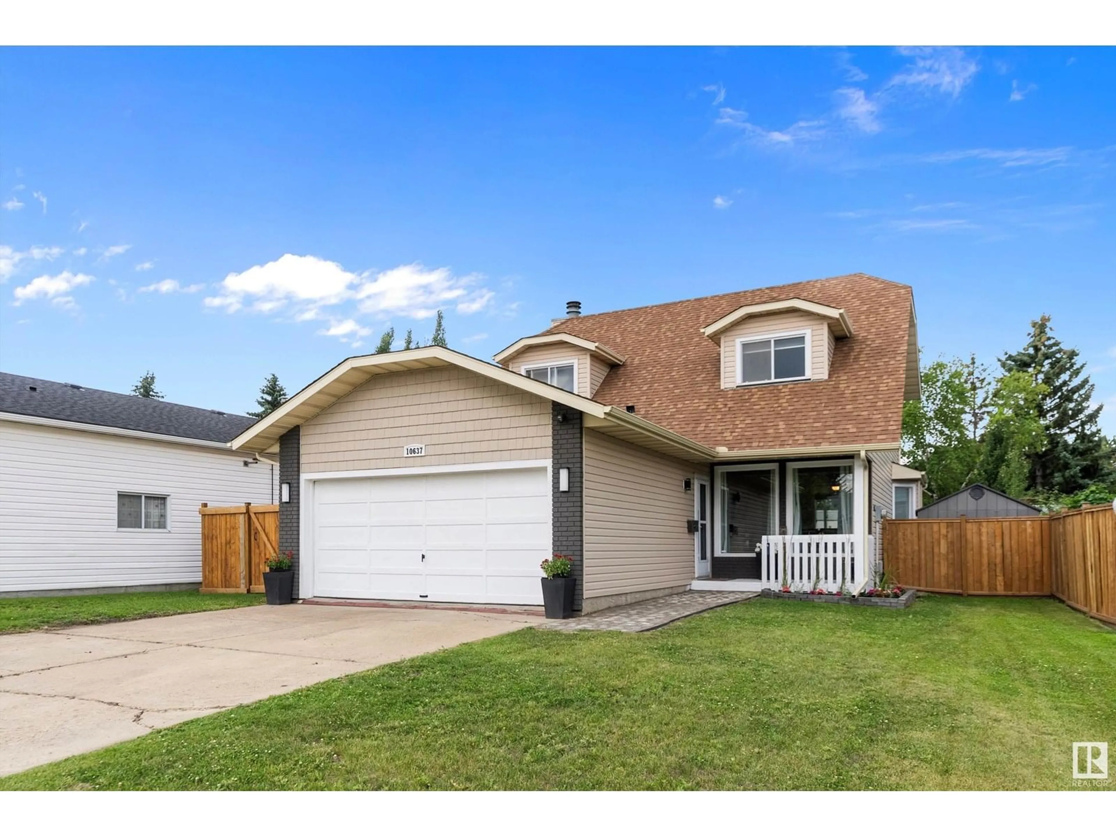 Home with vinyl exterior material, street for 10637 11 AV, Edmonton Alberta T6J6J5